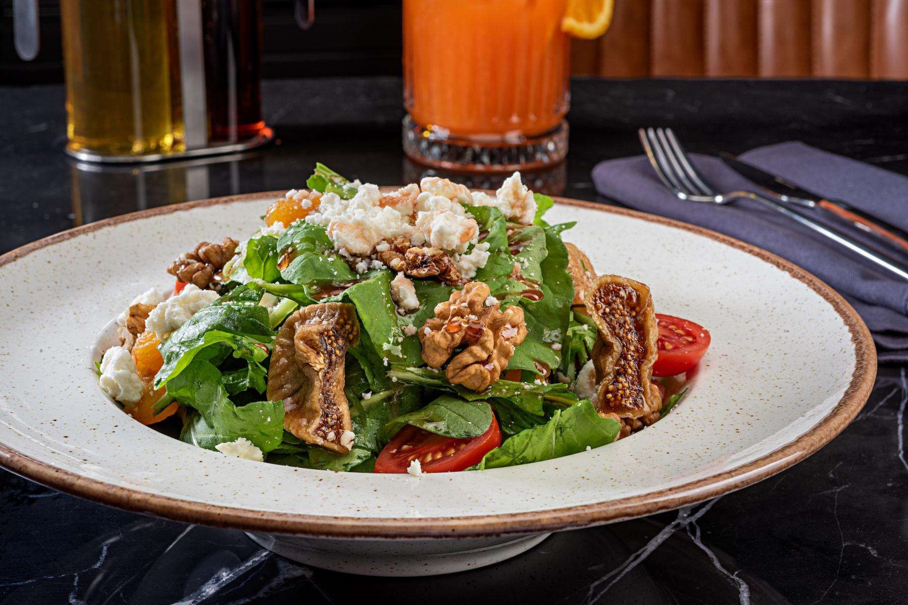 Mixed green salad in bowl.