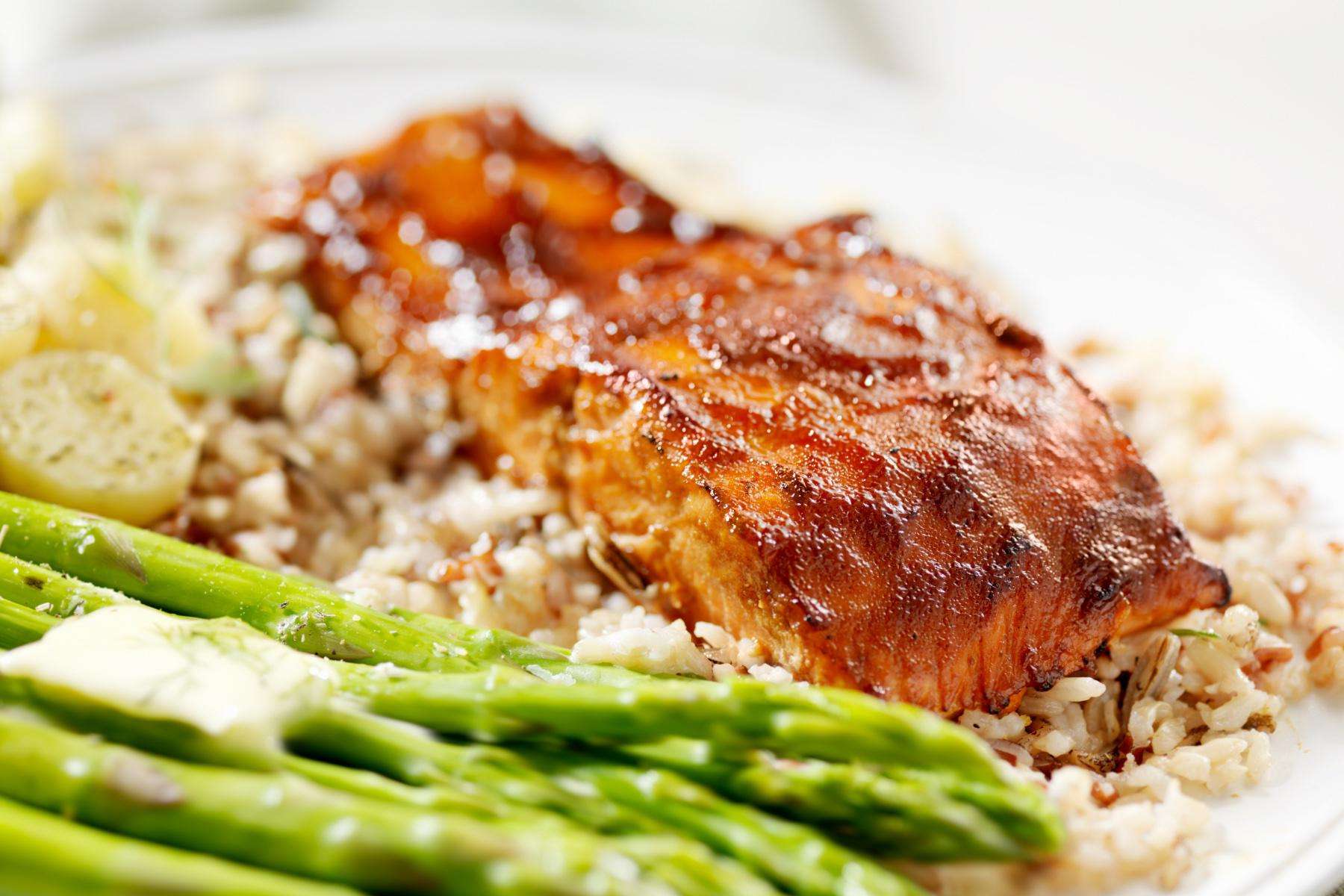 A plate of sautéed trout with orange anise glaze.