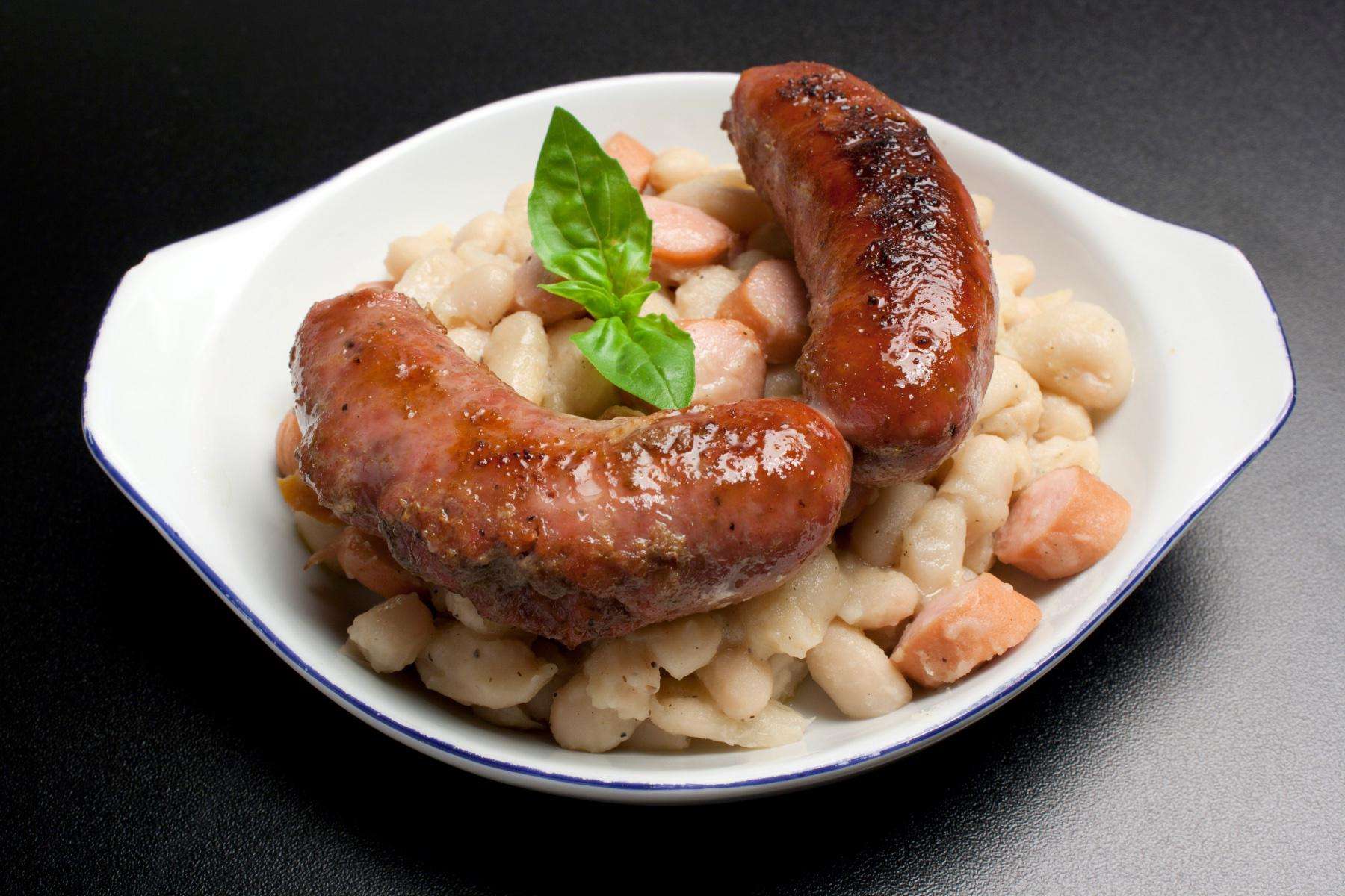 A plate of pasta with rapini and Italian Chicken Sausage.