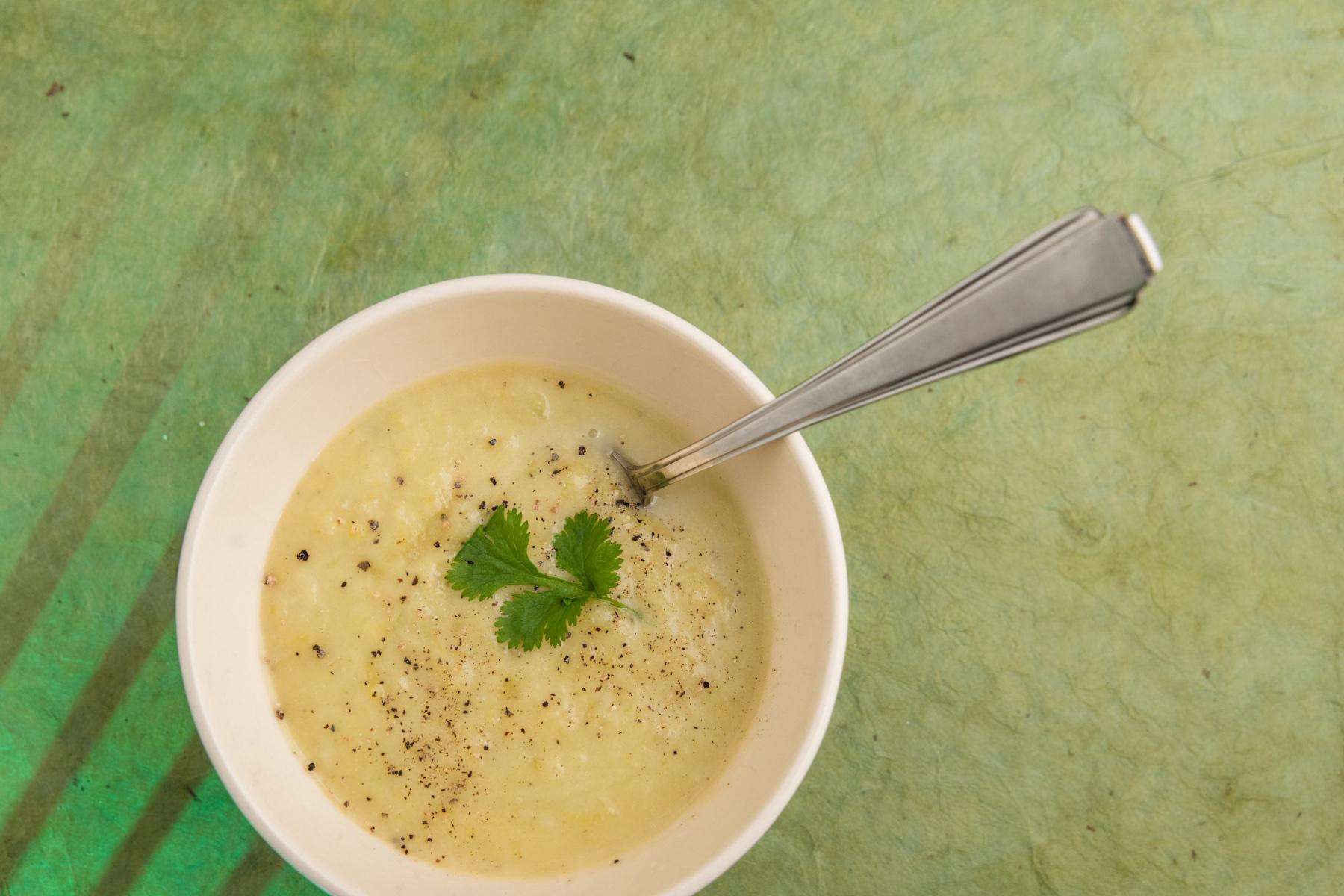 Overhead view of a bowl of celery soup.