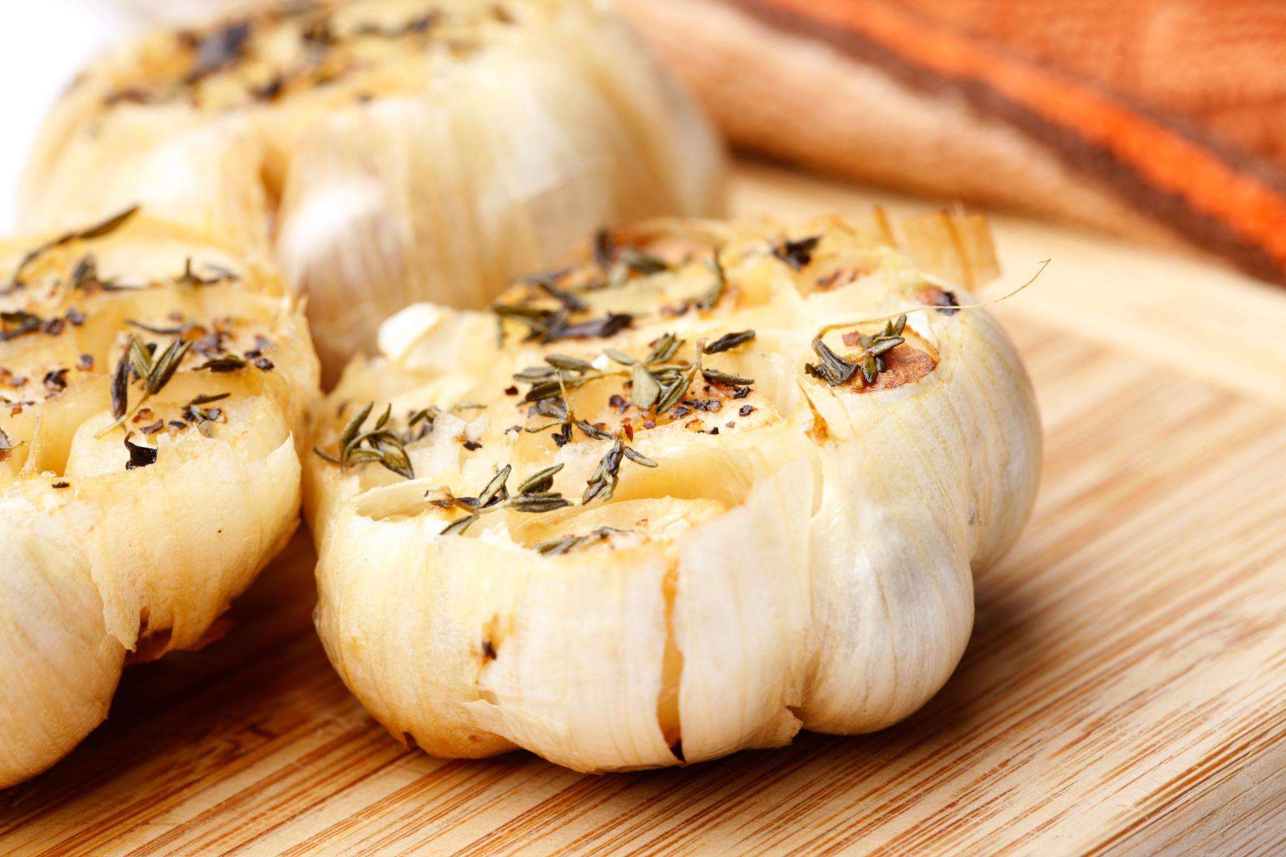 Close-up of cloves of garlic on cutting board