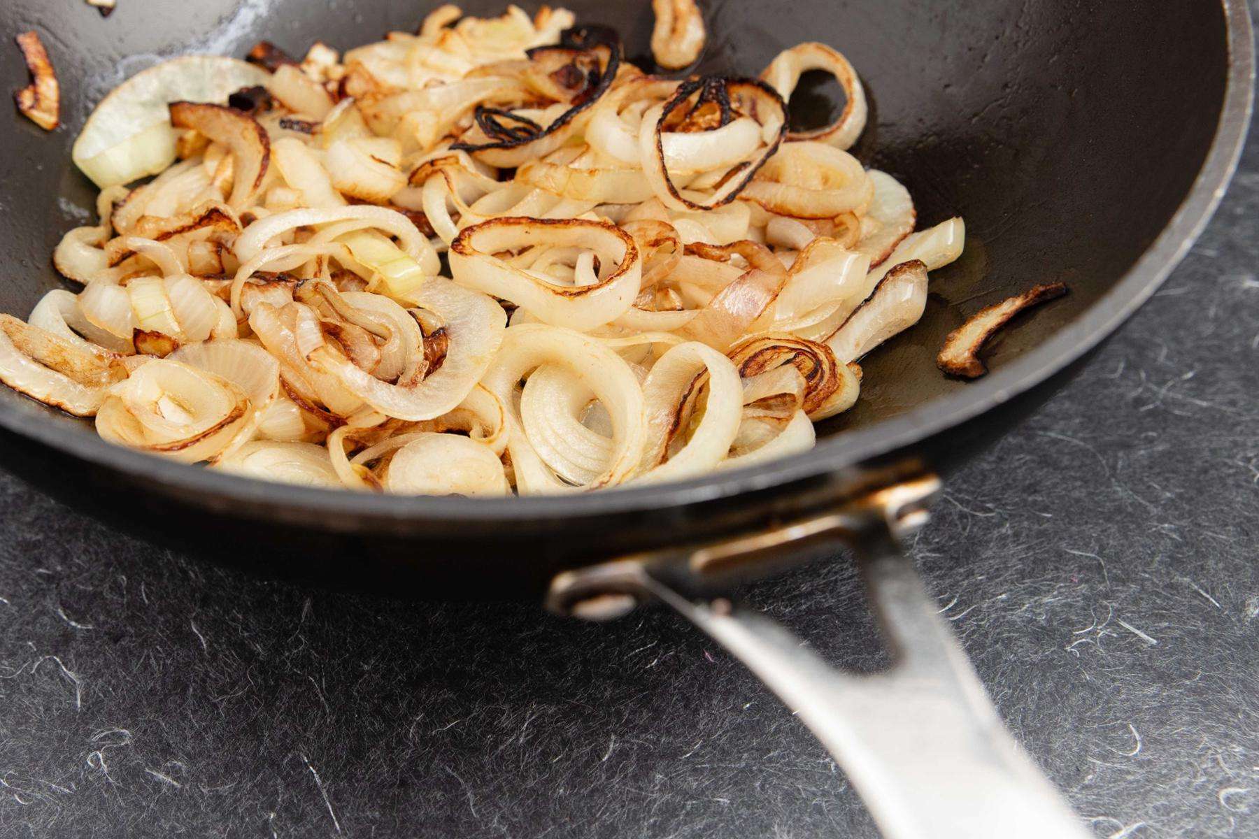 Onions in frying pan.