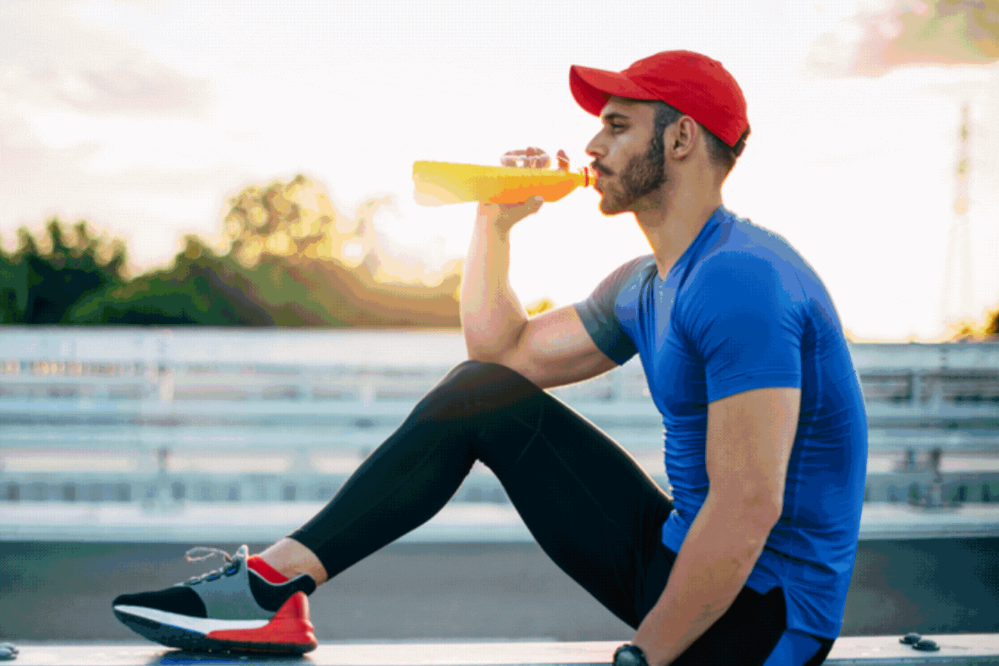 A rotating image of liquids and a man drinking
