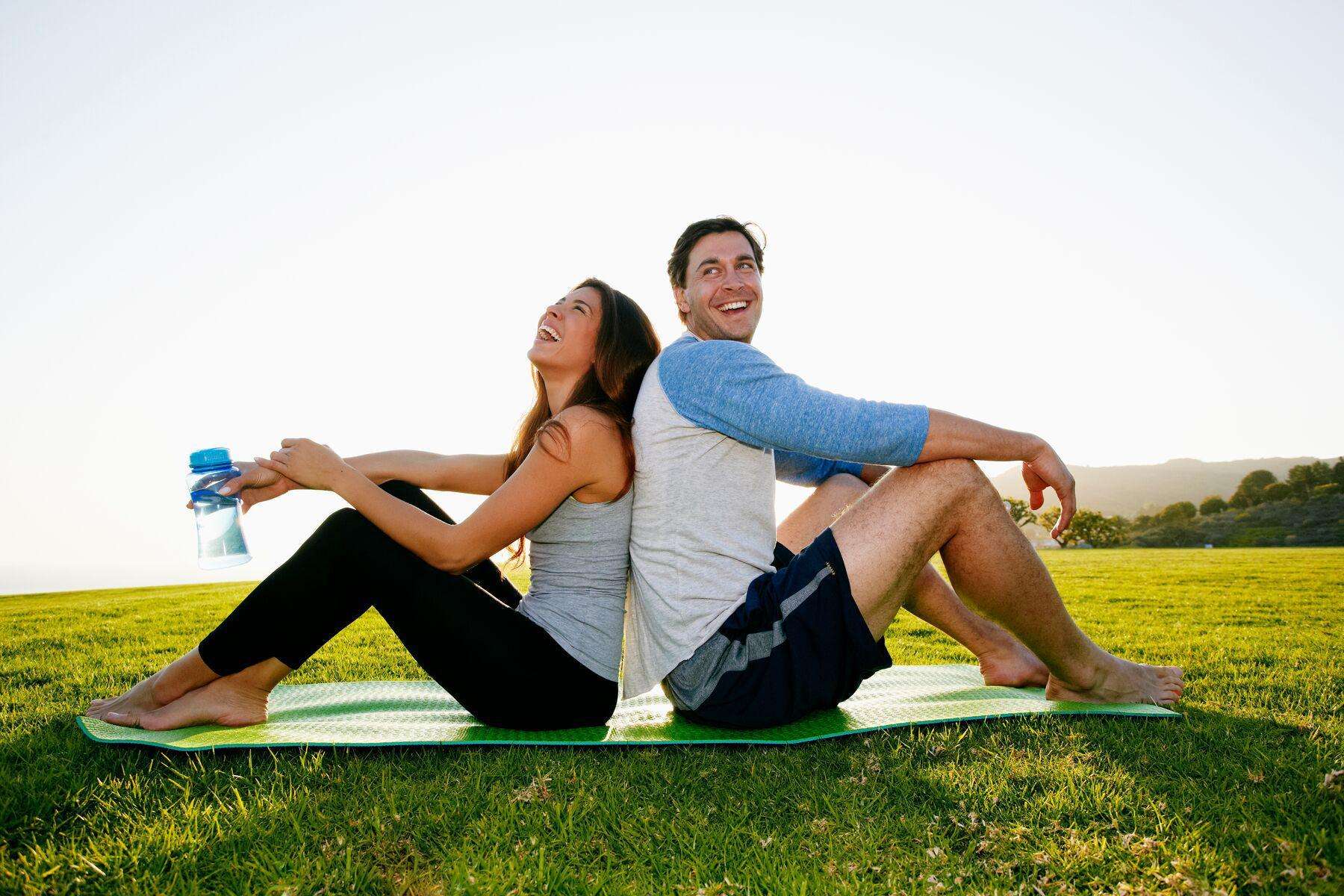 A couple sitting together on the Great Lawn at Canyon Ranch Lenox Fitness + Spa Resort