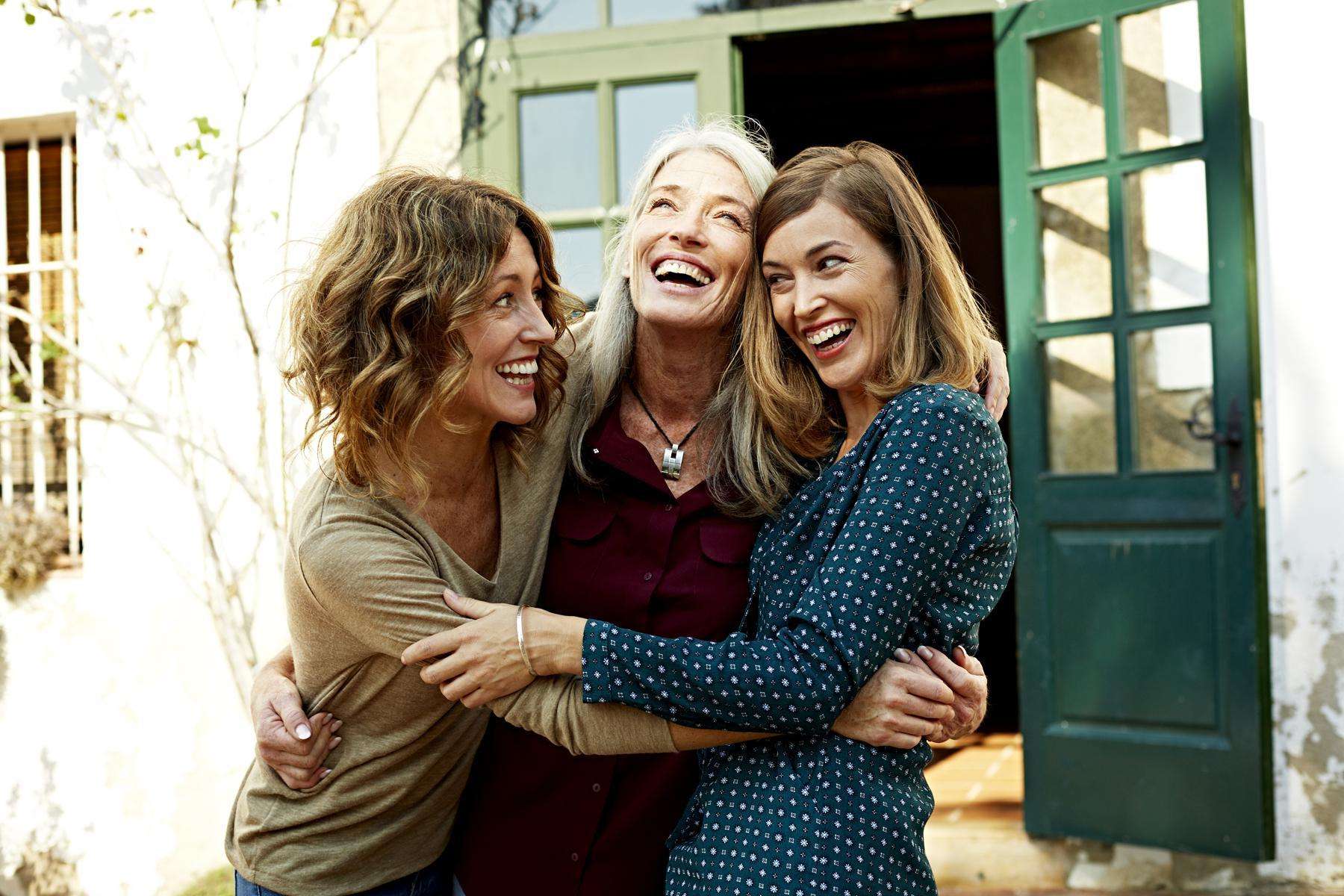 a group of women hugging