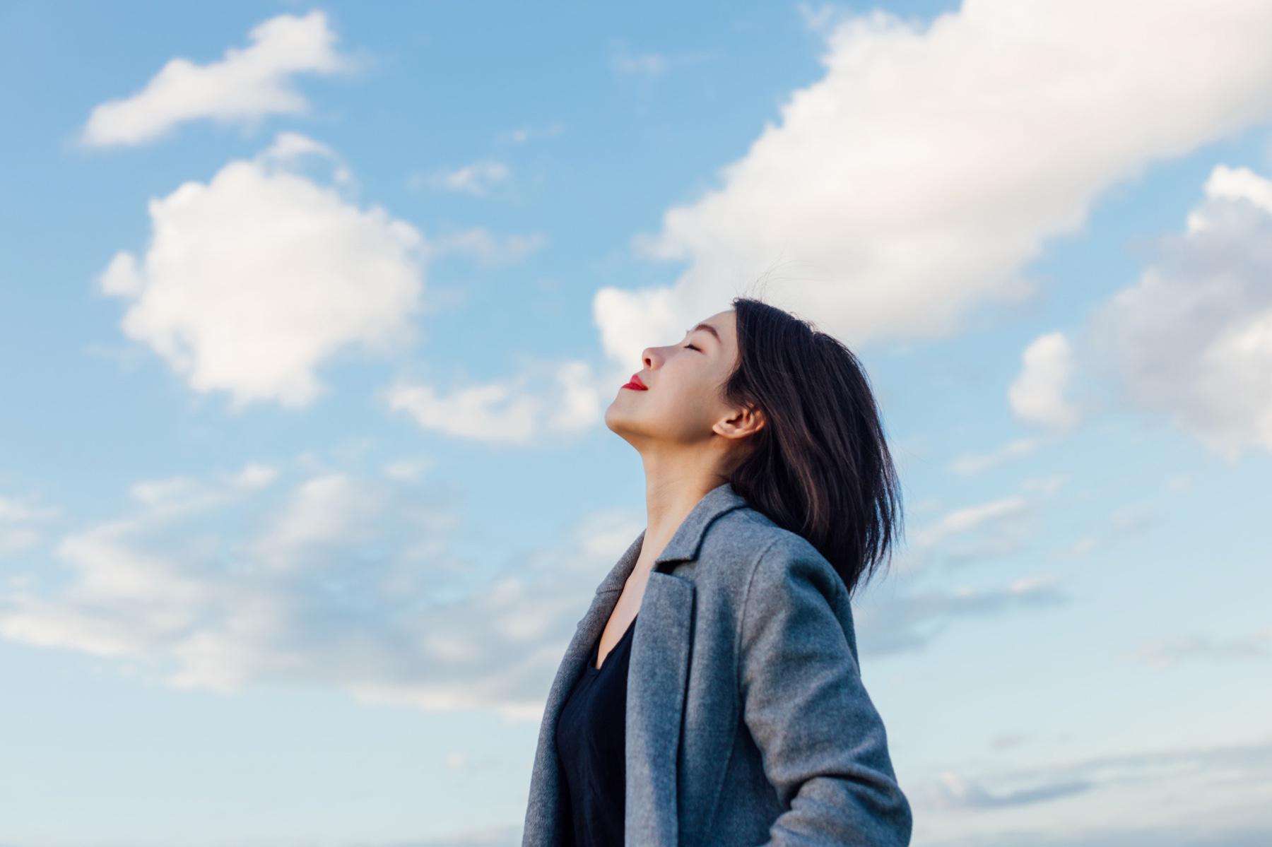 Woman looking up at the sky.