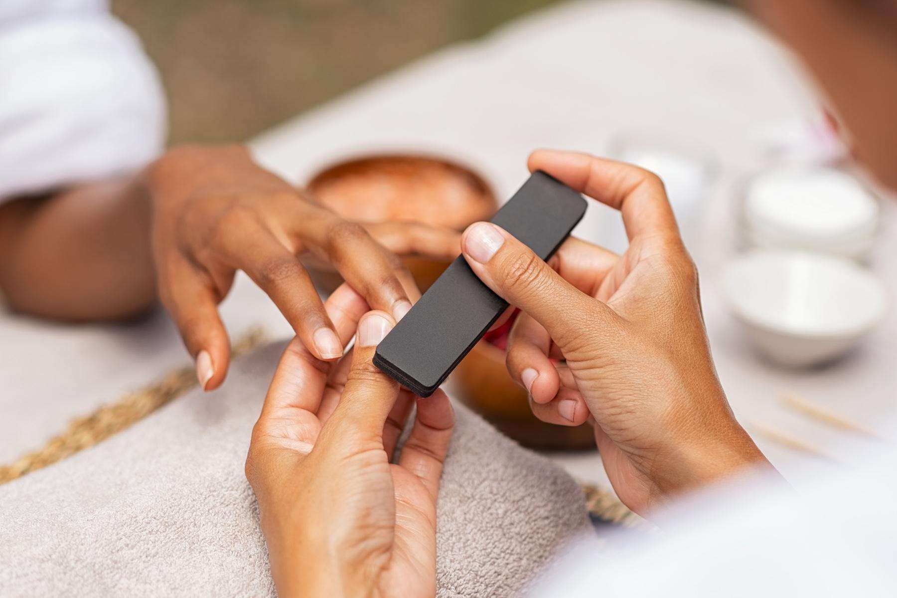 A woman getting a manicure.