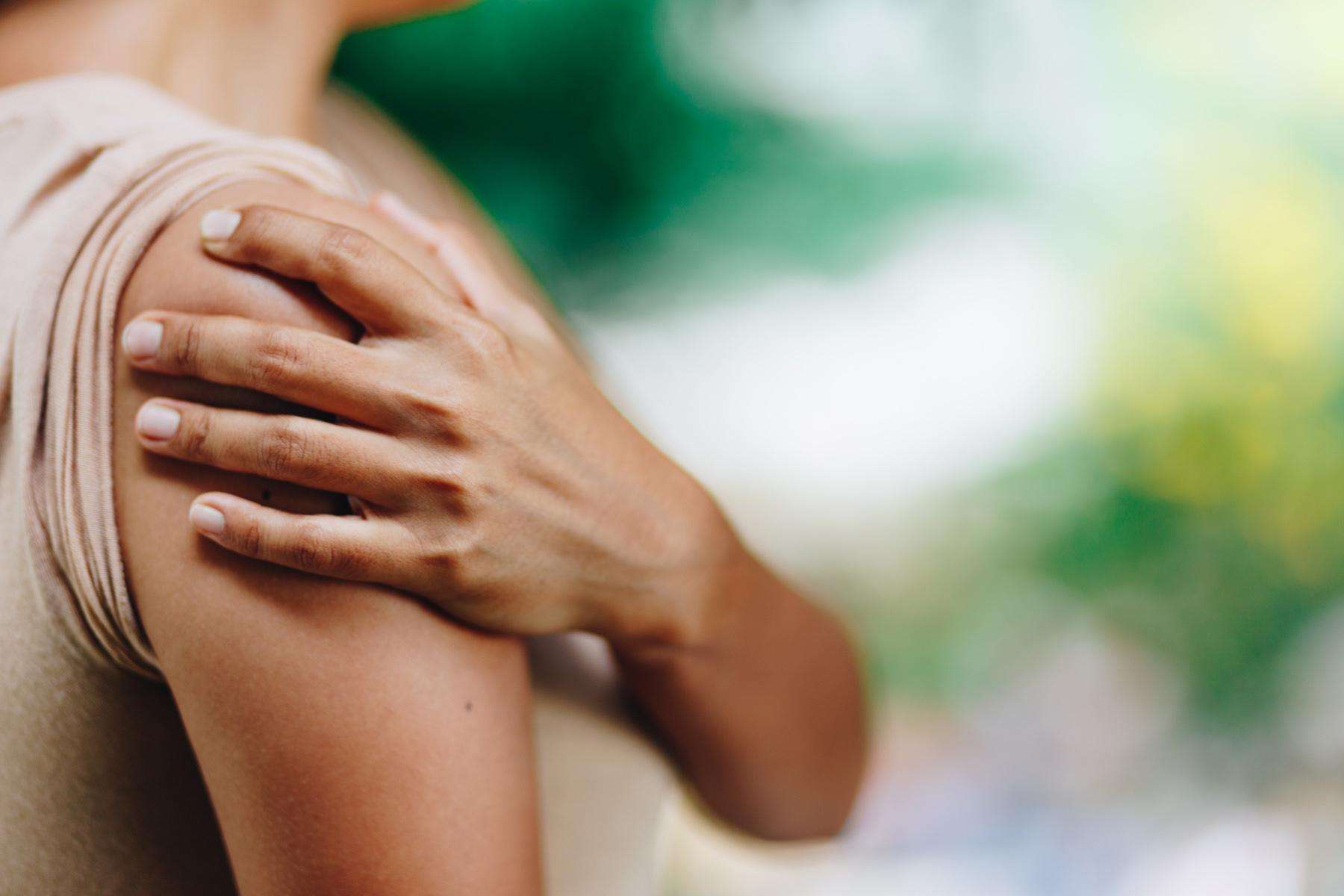 close-up of hand on shoulder
