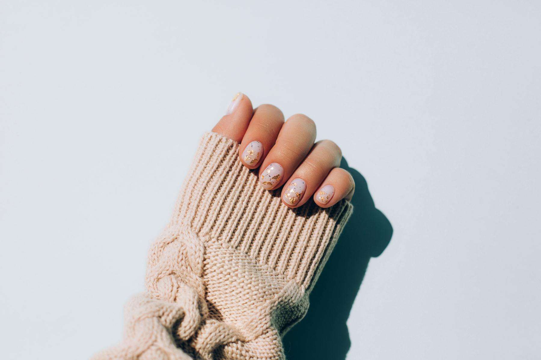 A close-up of a woman's painted nails.
