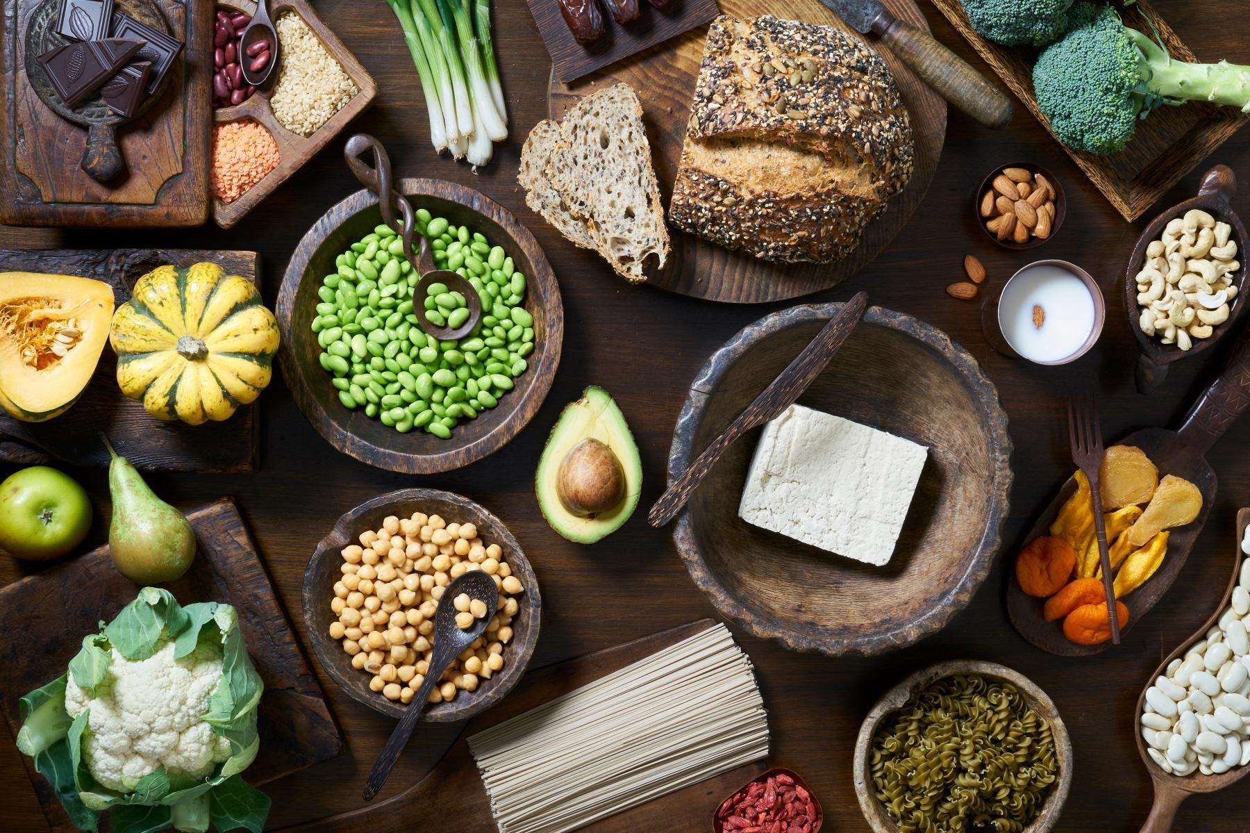 Overhead table shot of different types of cards such as bread and beans.