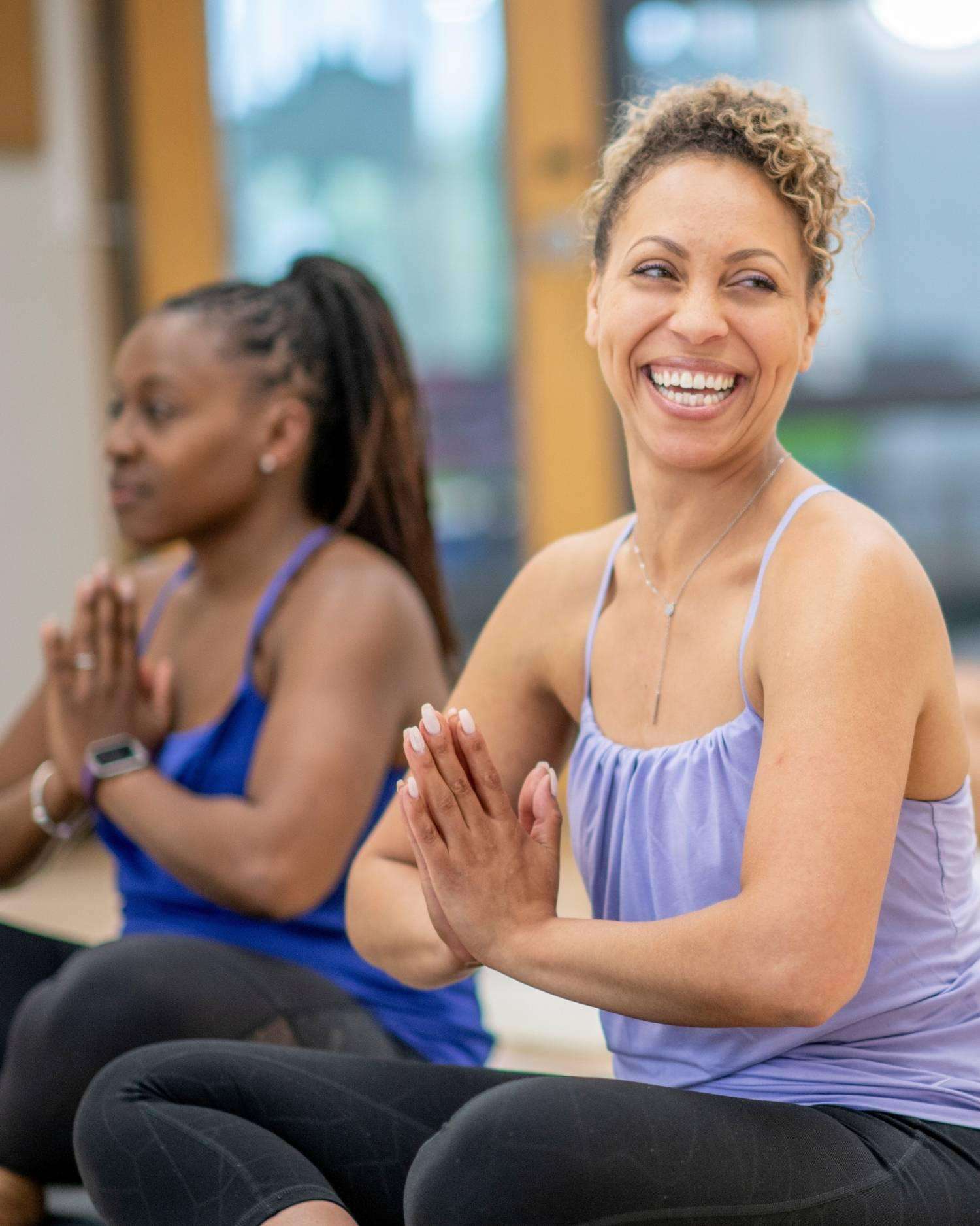 women in a group yoga class