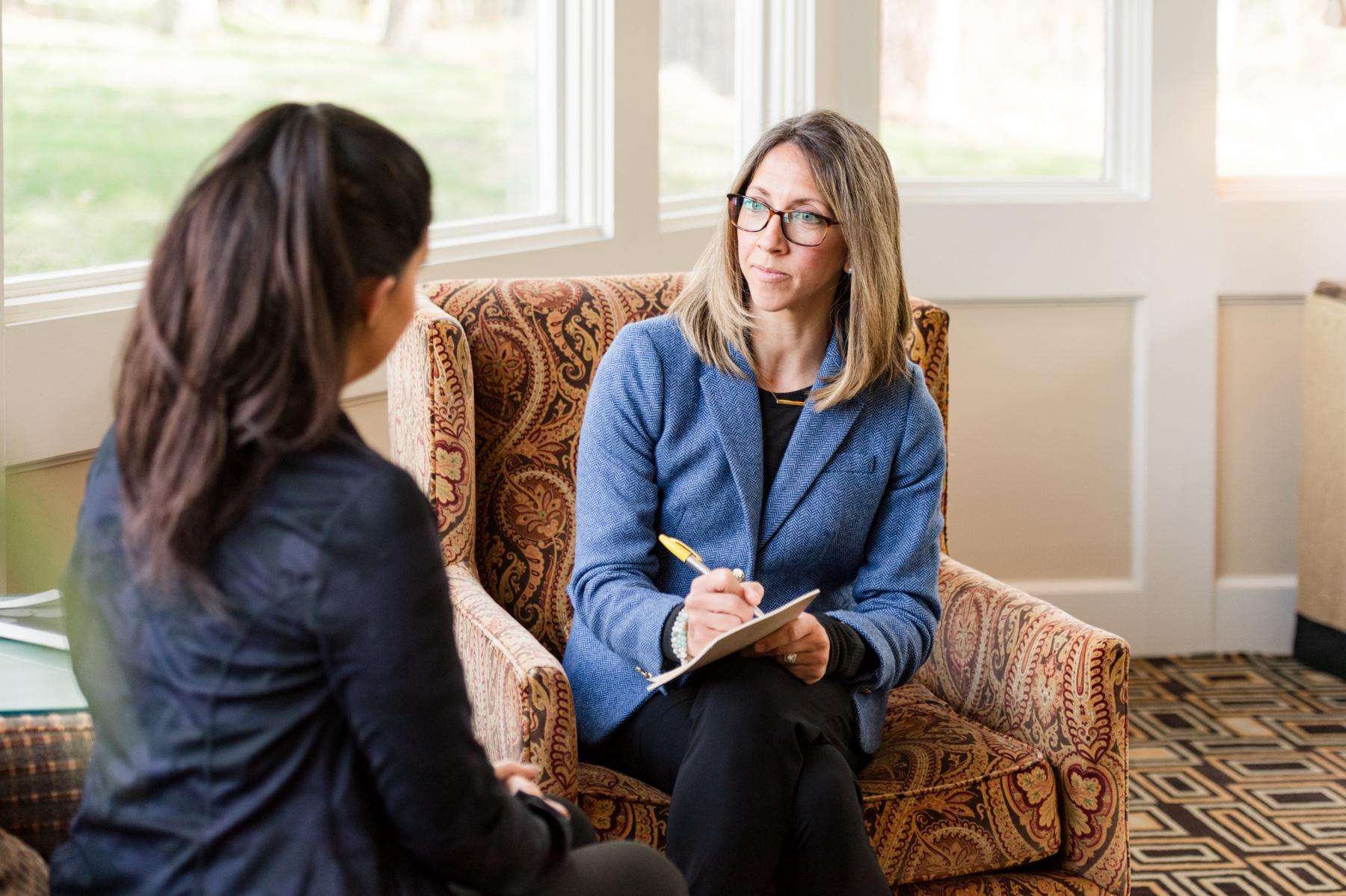 Woman speaking with an expert.