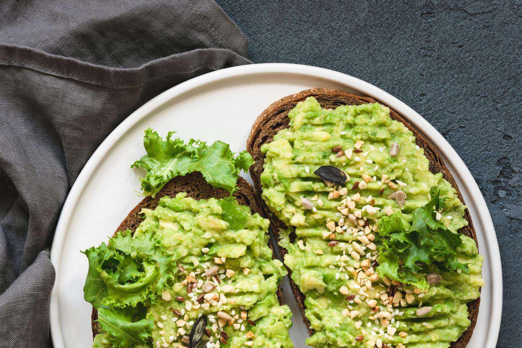 overhead view of plate with two slices of avocado toast