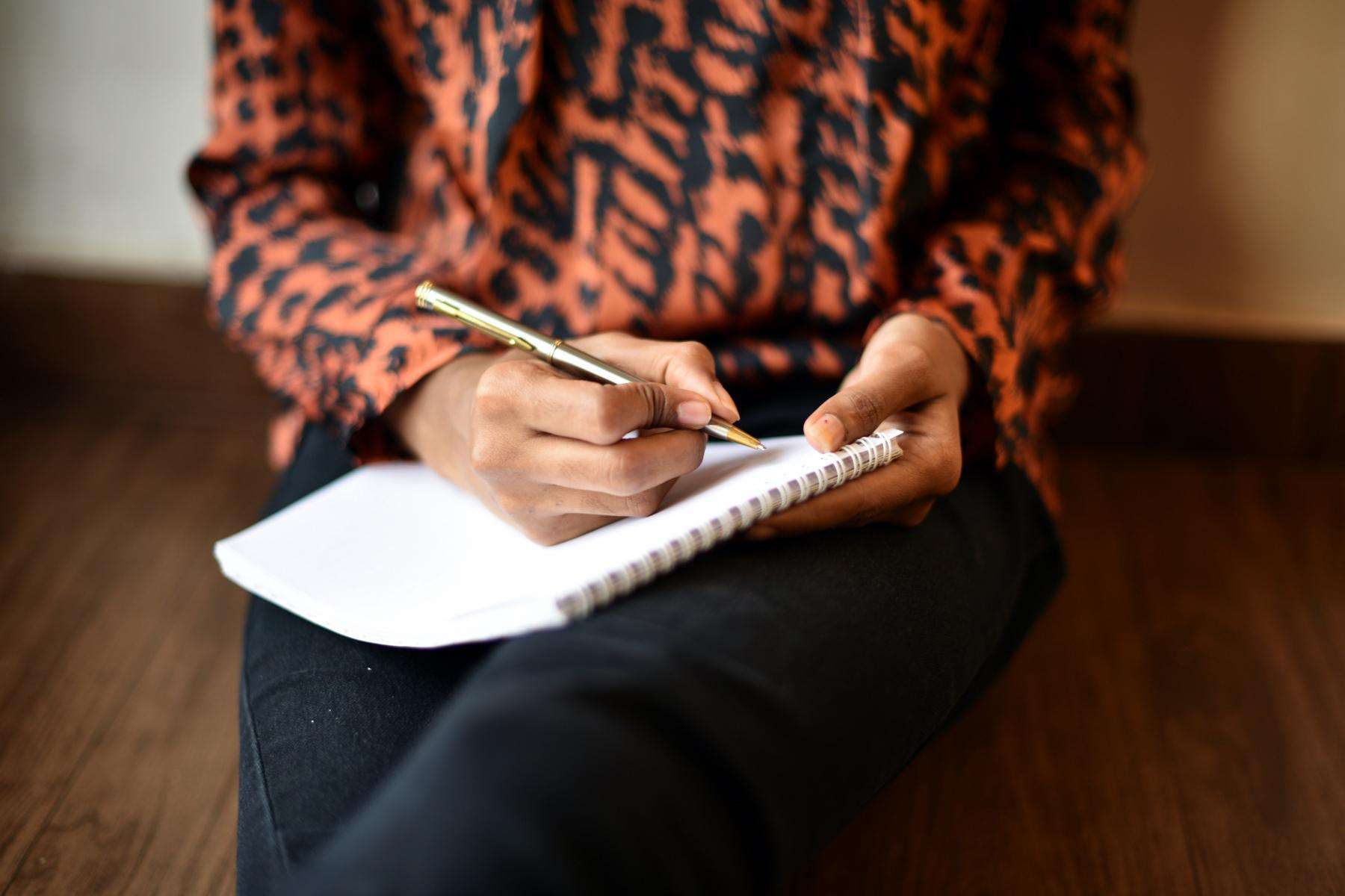 A woman writing in her journal