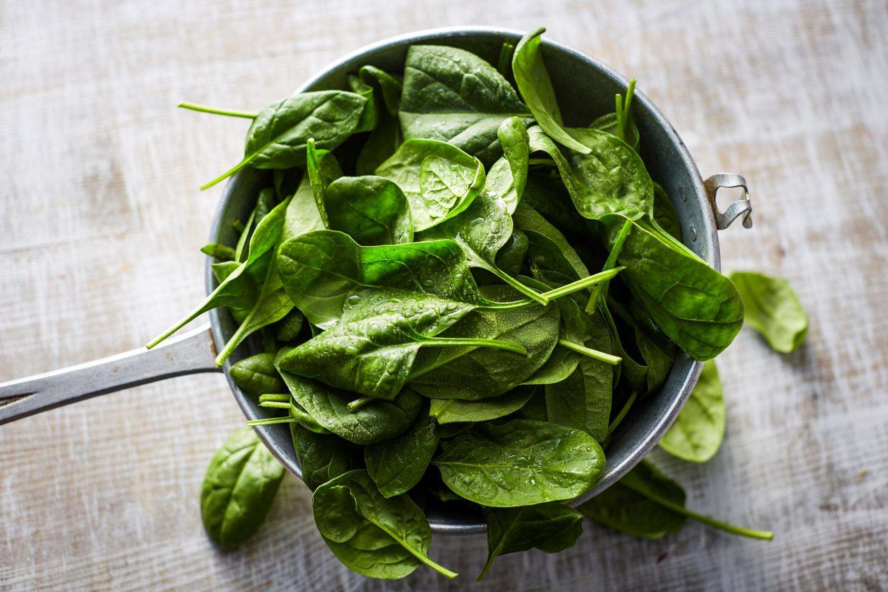 Overhead view of a bowl of spinach.