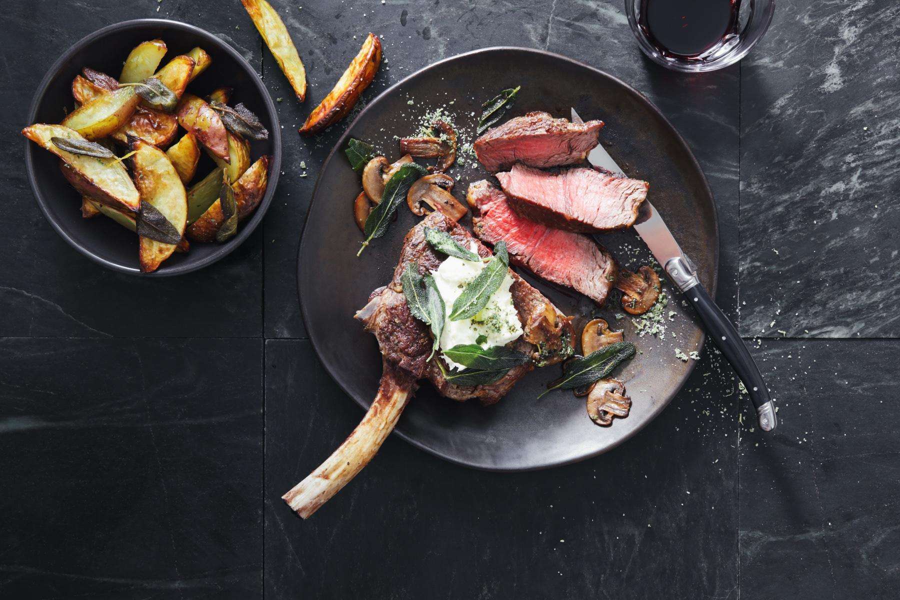 overhead view of a cooked steak on a plate