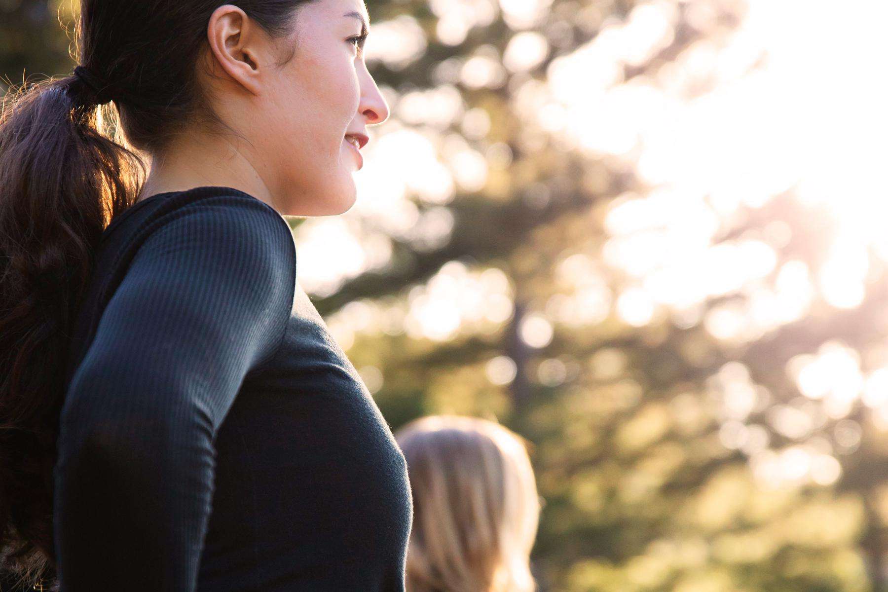 close-up of woman's face as she stretched outside