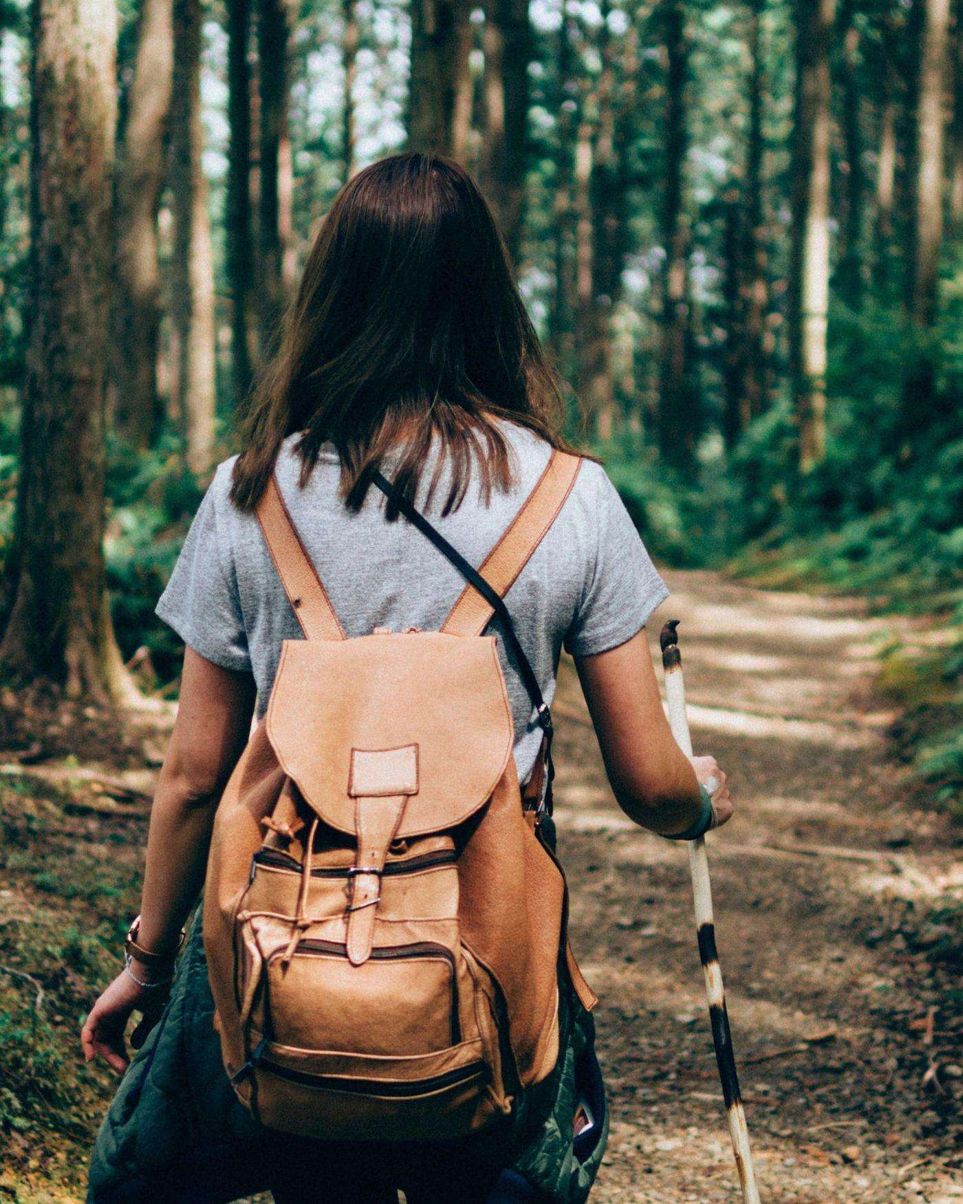 A woman hiking in the forest