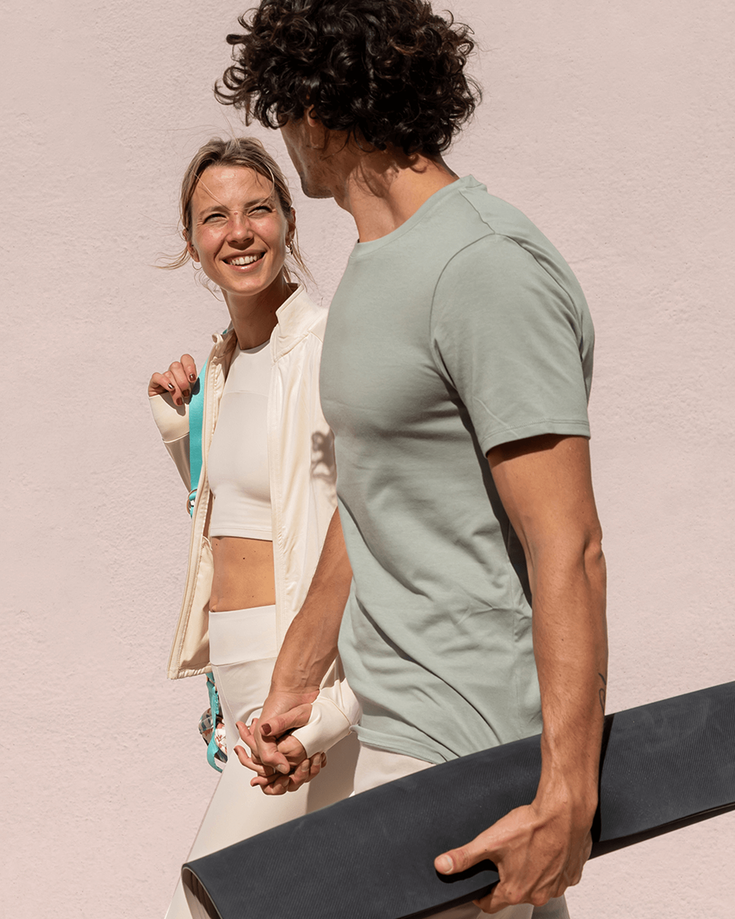A man and woman walking to yoga class