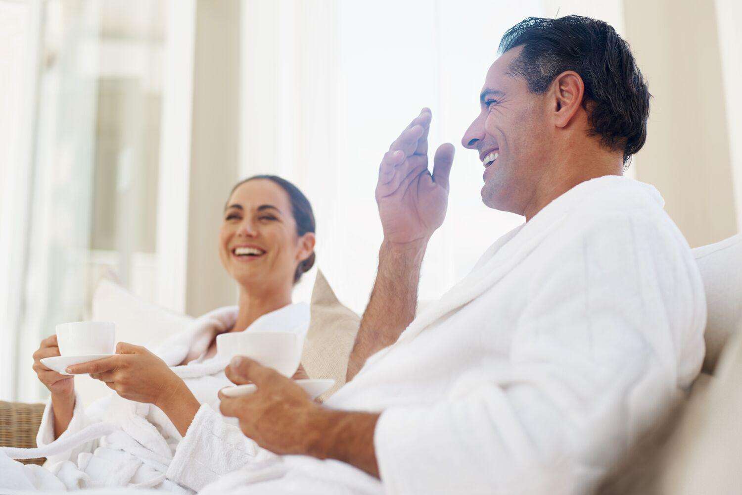couple wearing robes and relaxing in spa