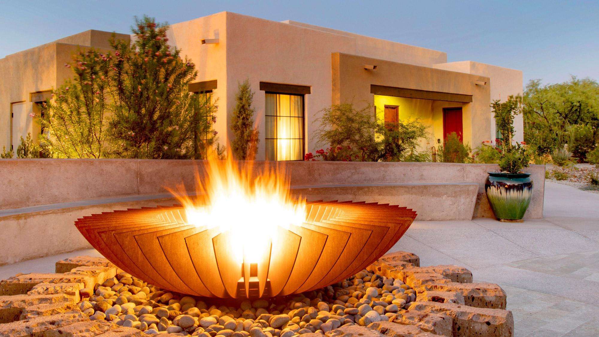 Circular fire pit burning in front of guest room
