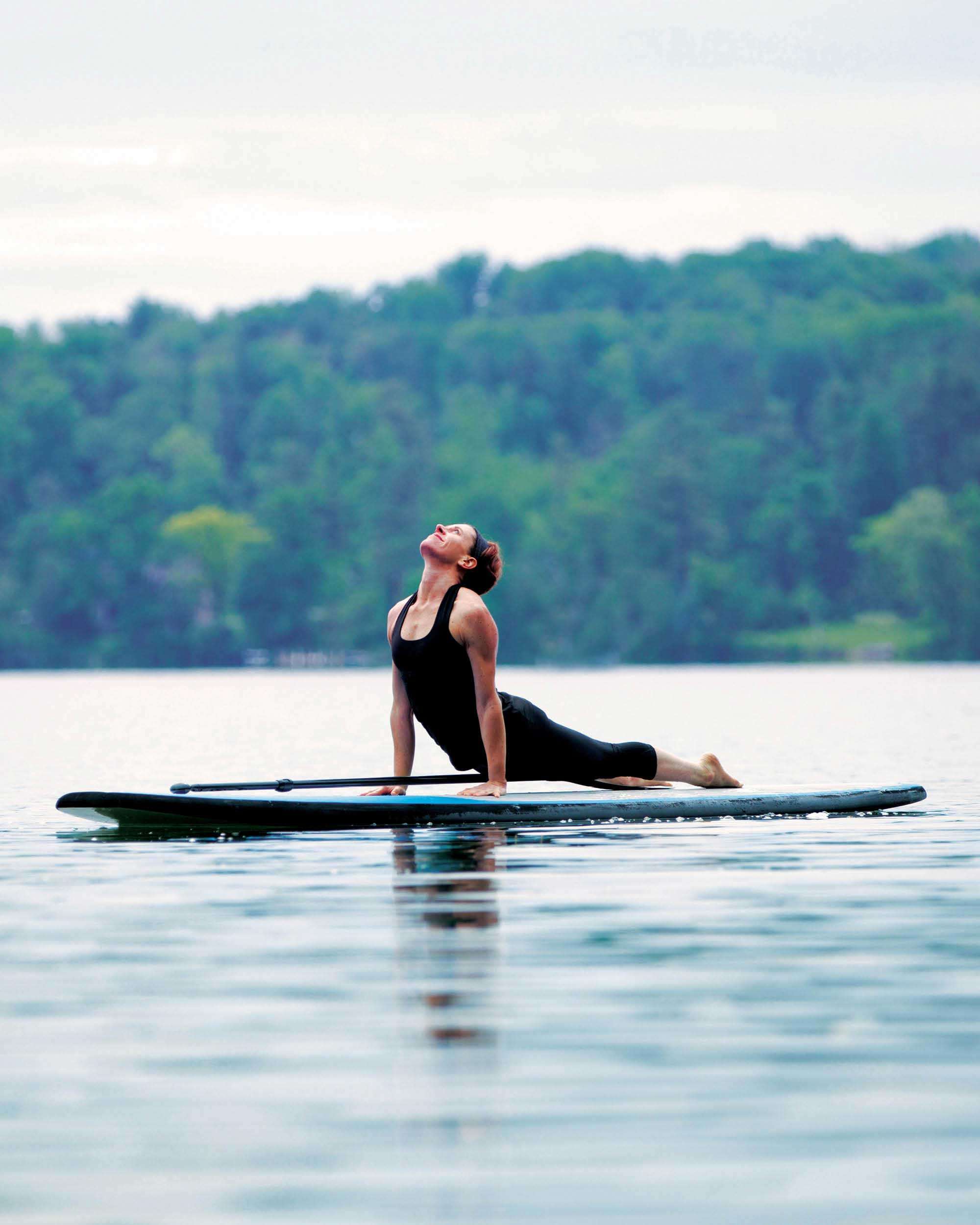 A woman paddleboarding