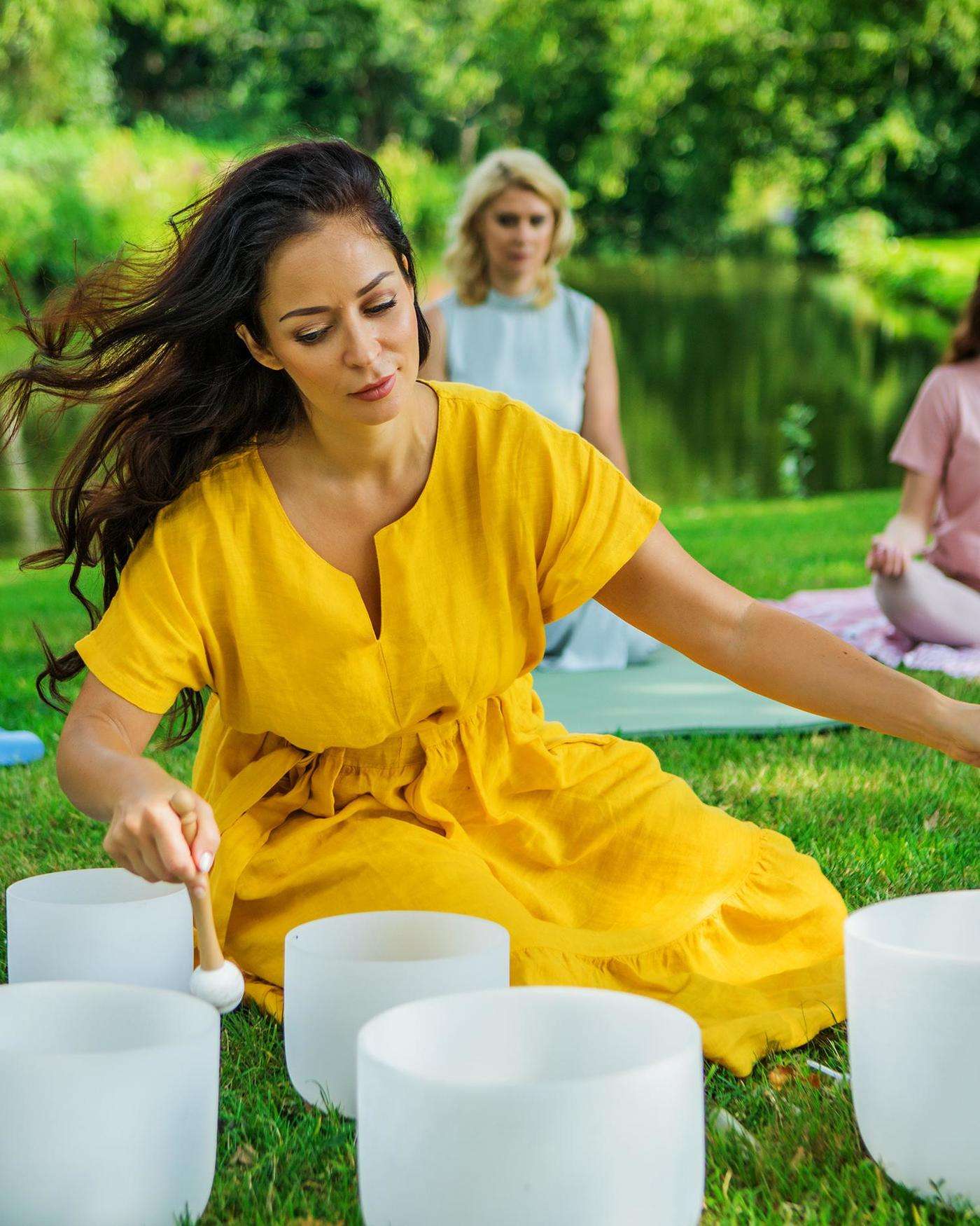 A group having a sing along by a campfire