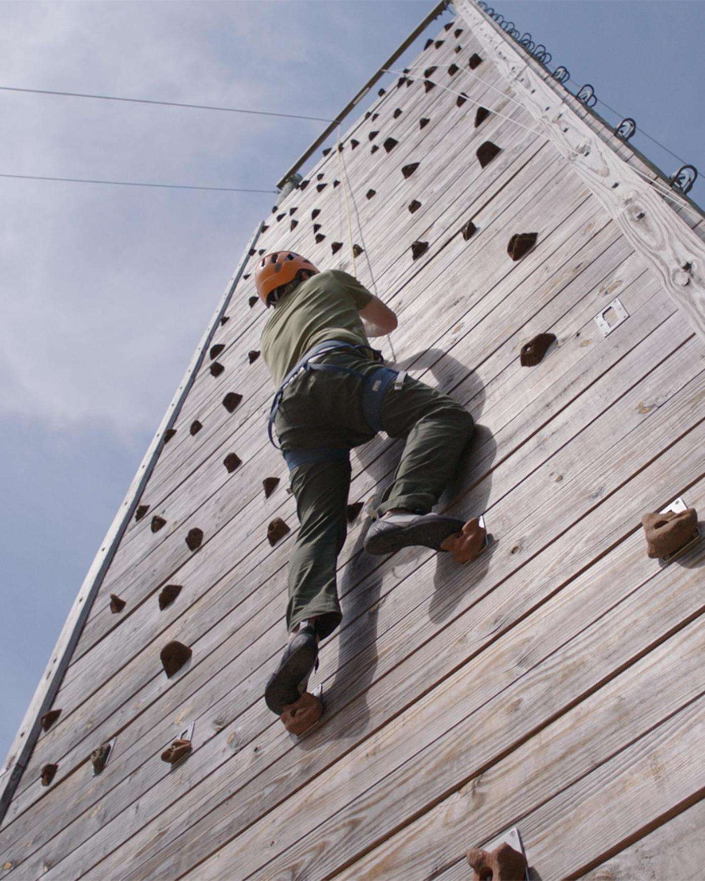 A man climbing on a wall