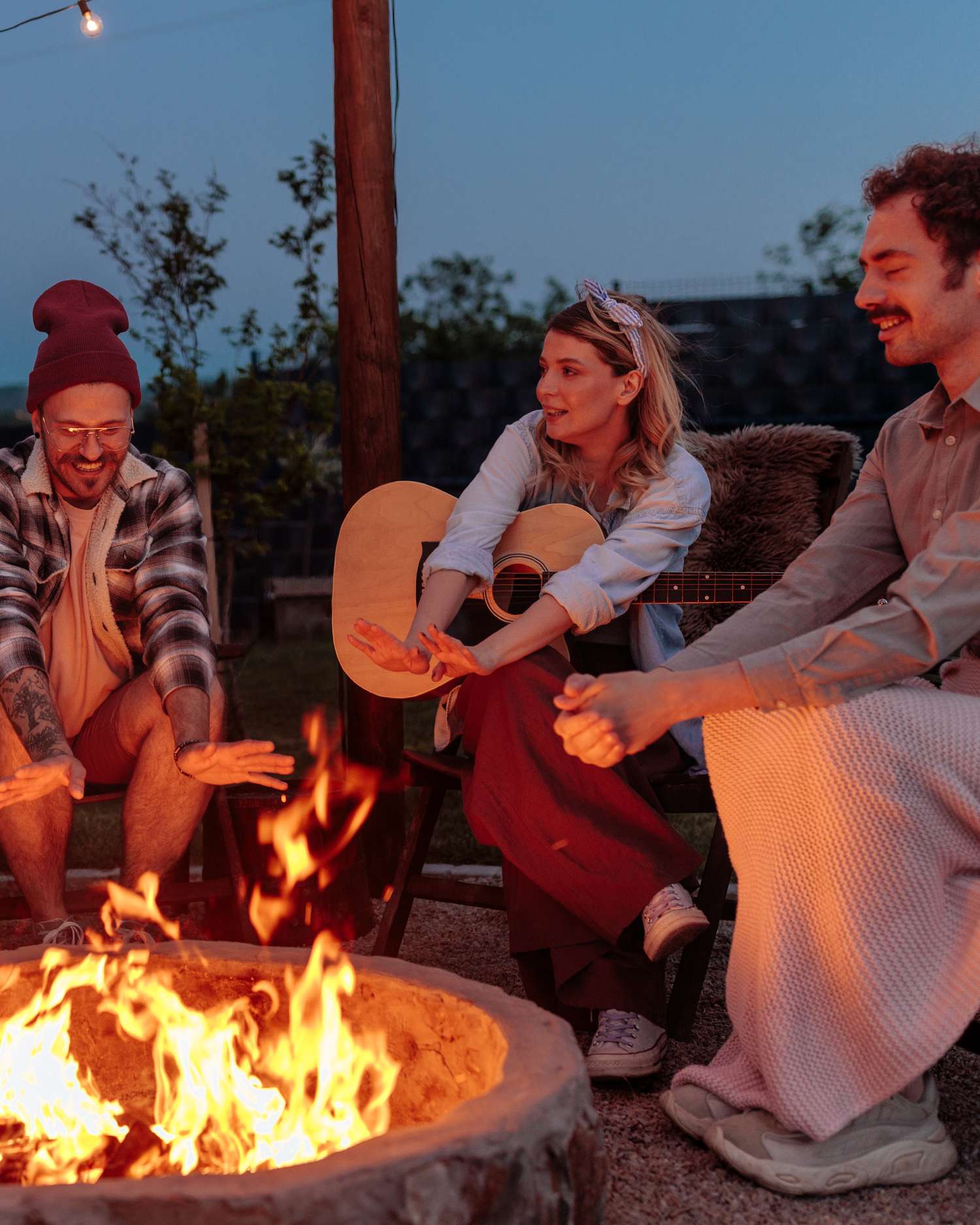 a group of people at a campfire