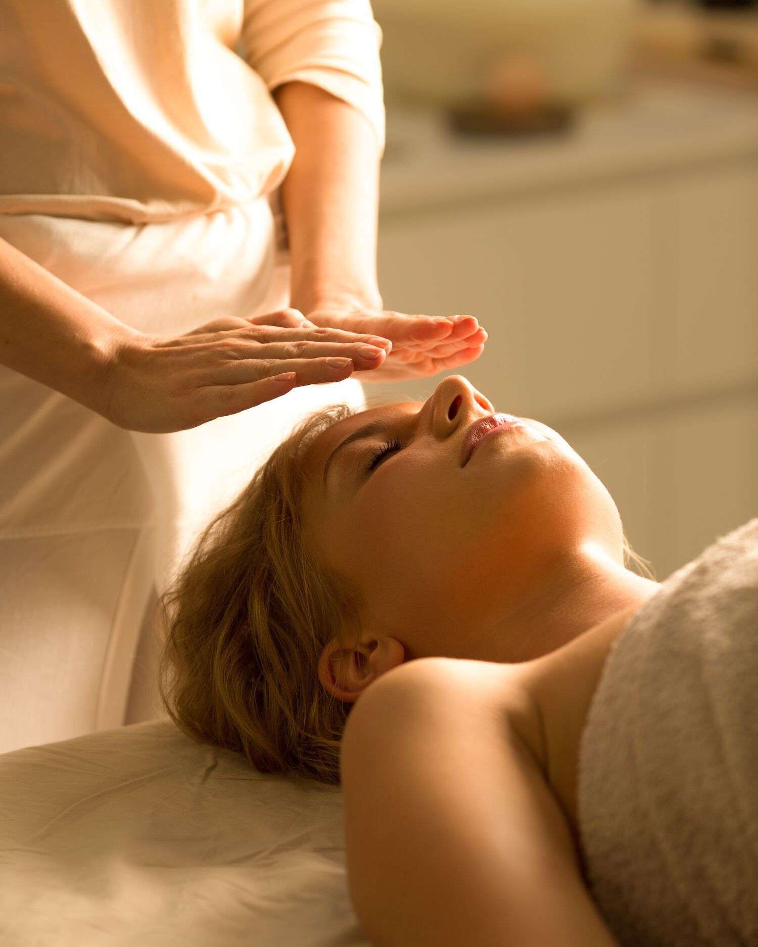 A woman getting a reiki healing