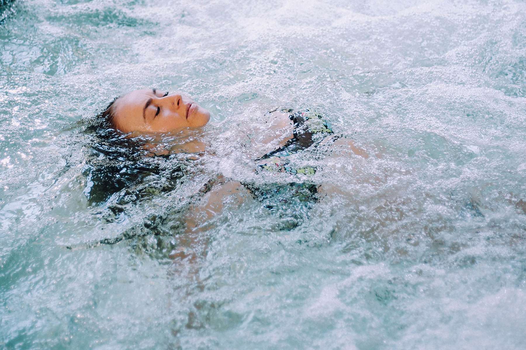 a woman swimming in water