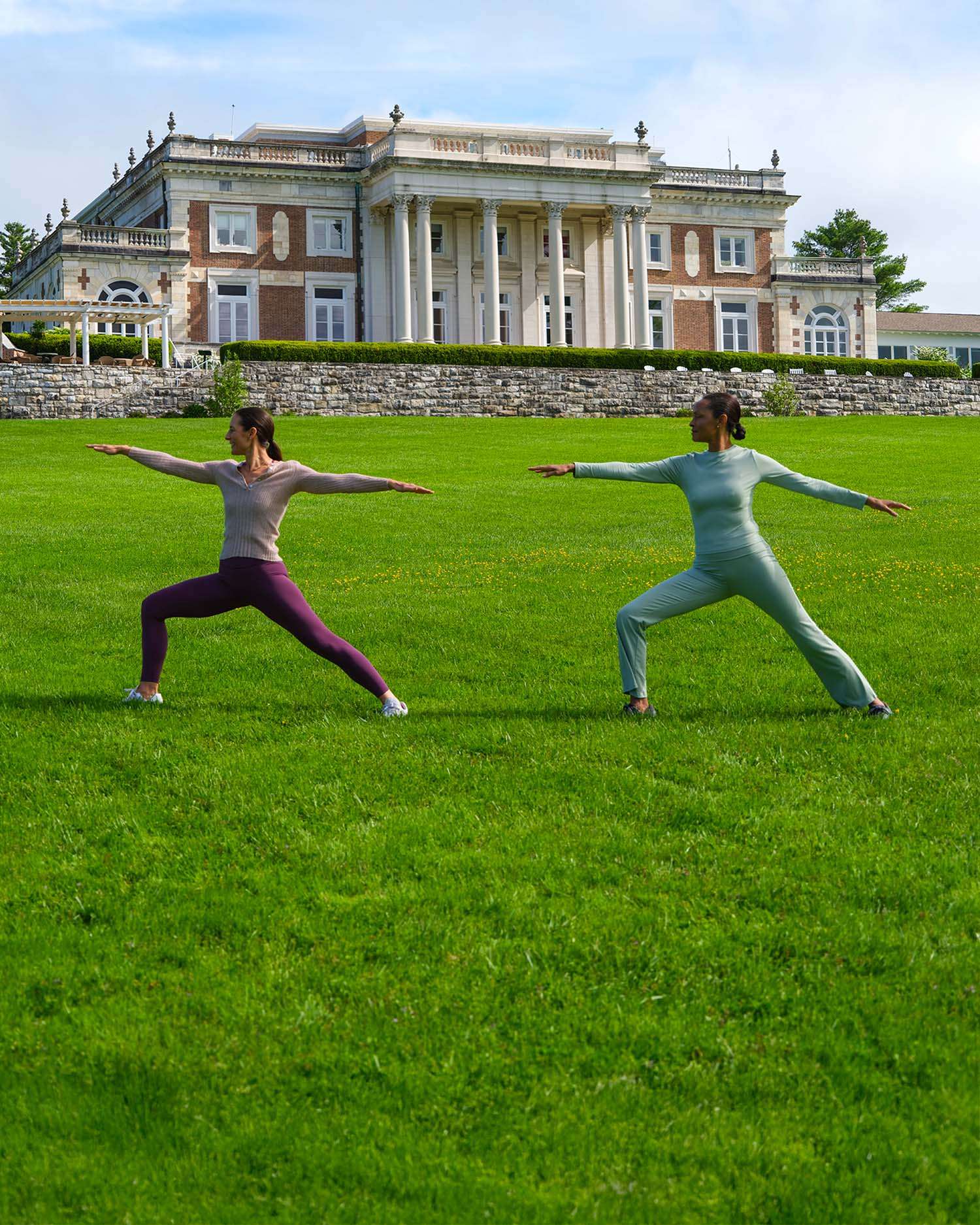 two women working out in front of the Lenox Mansion