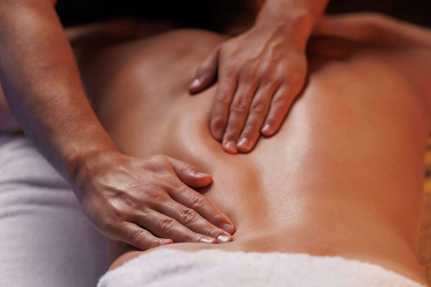 A woman getting a hot oil massage