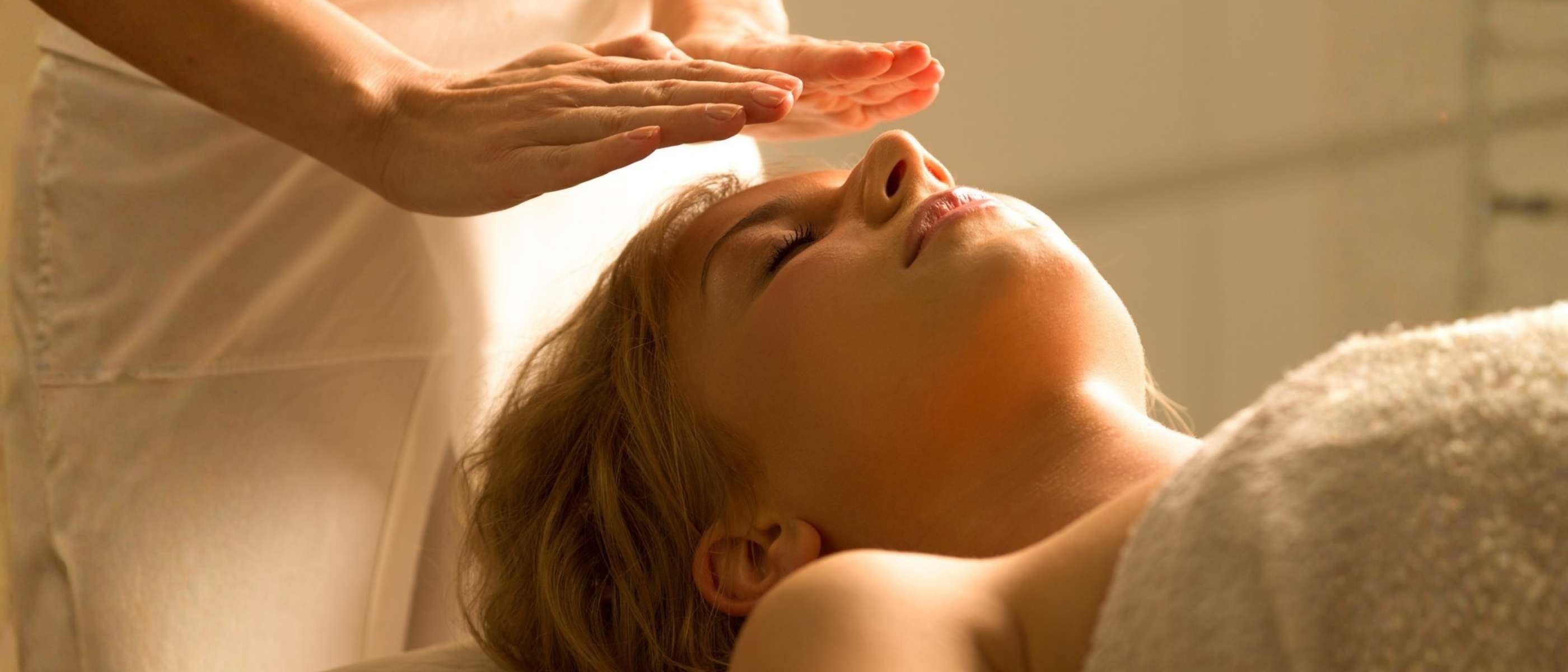 A woman getting a reiki healing