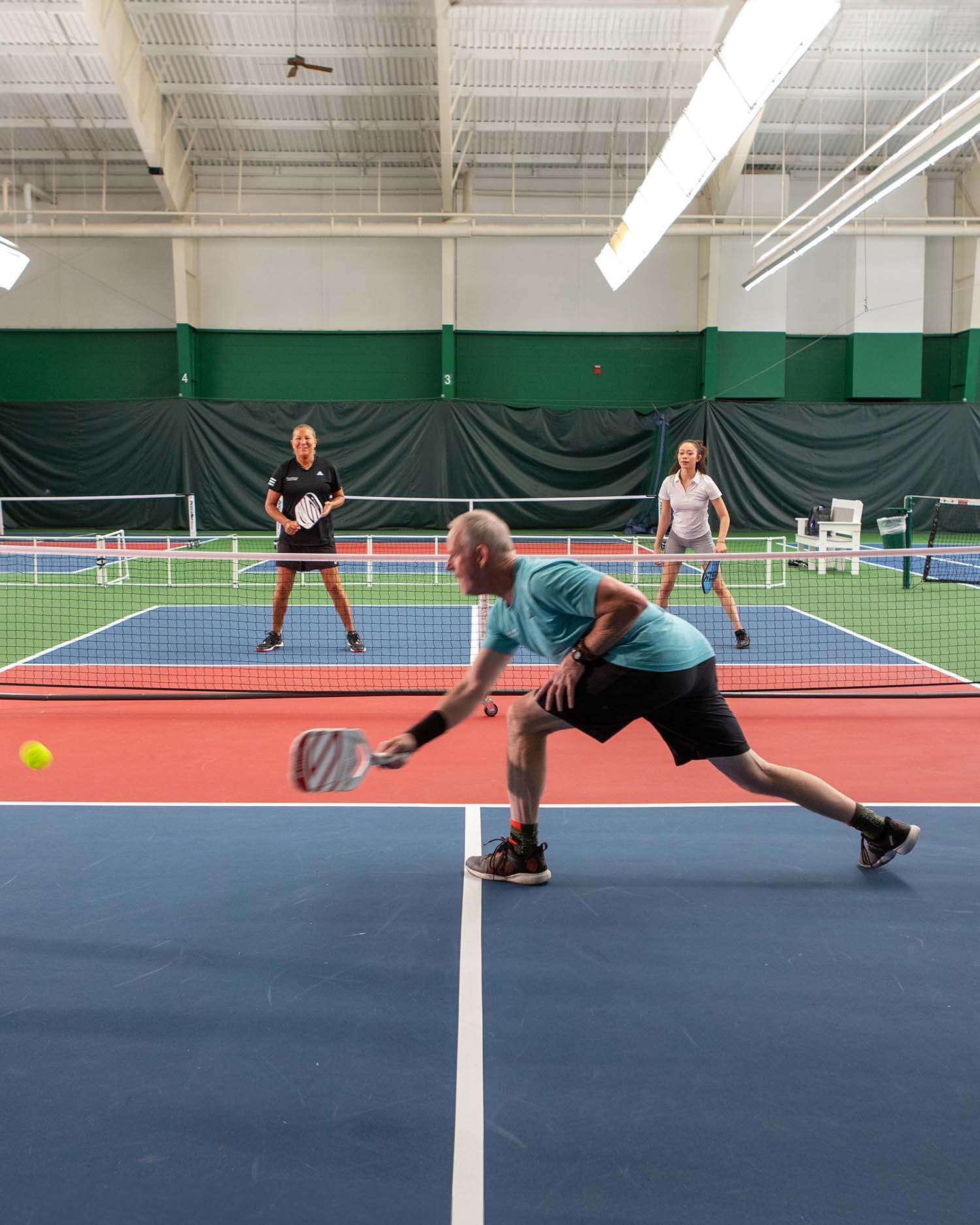 a couple playing pickleball