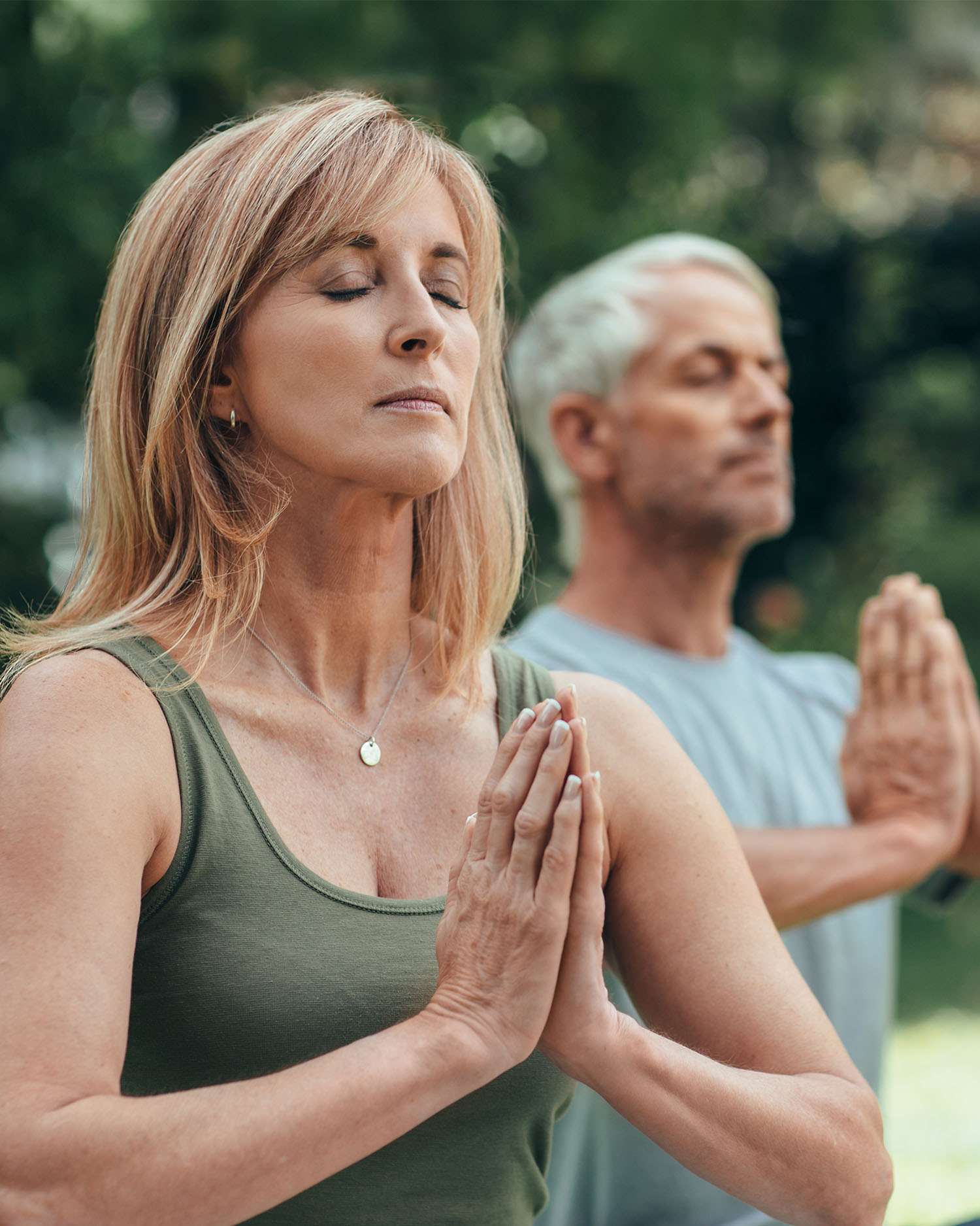 A man and woman meditating