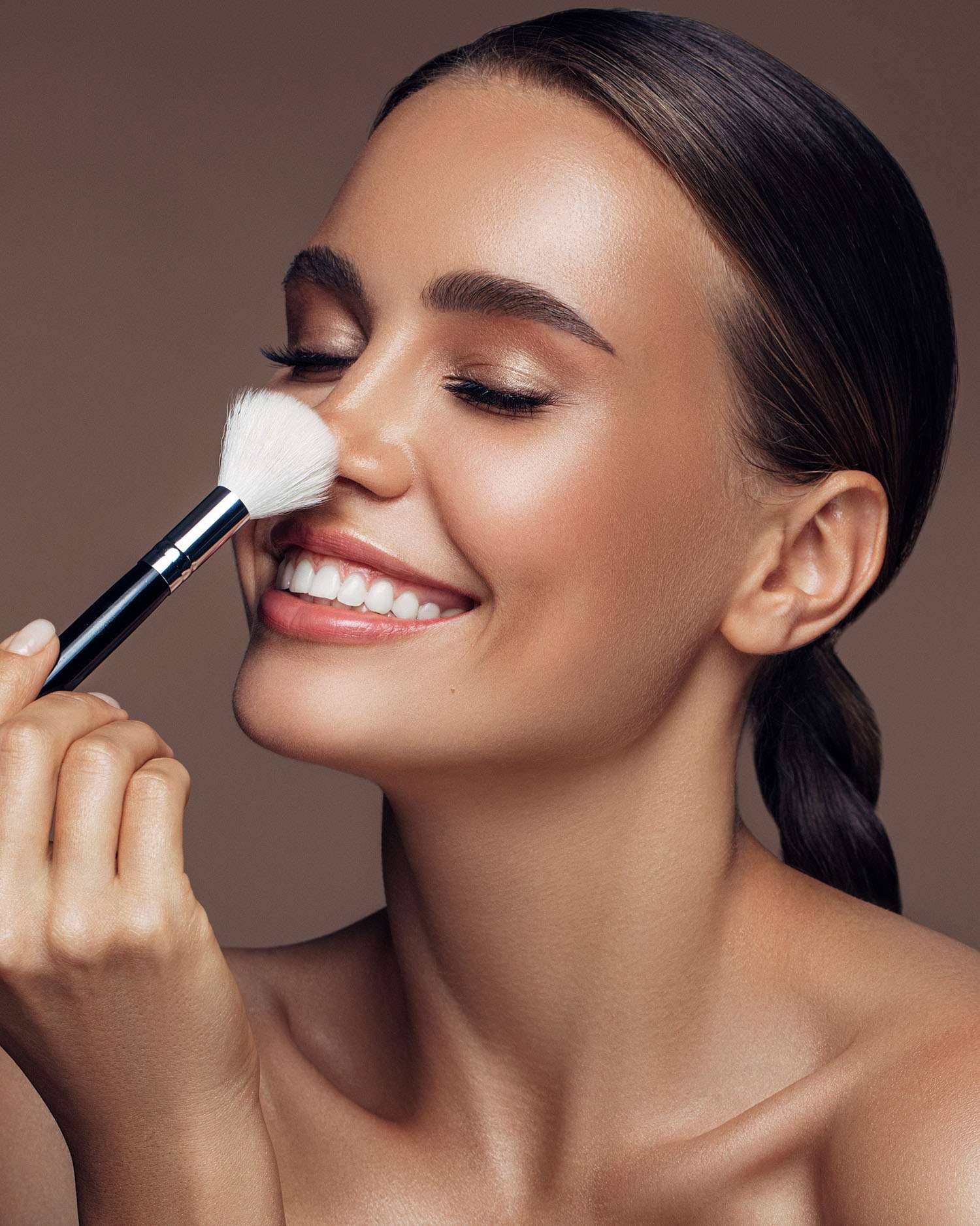 a woman applying makeup