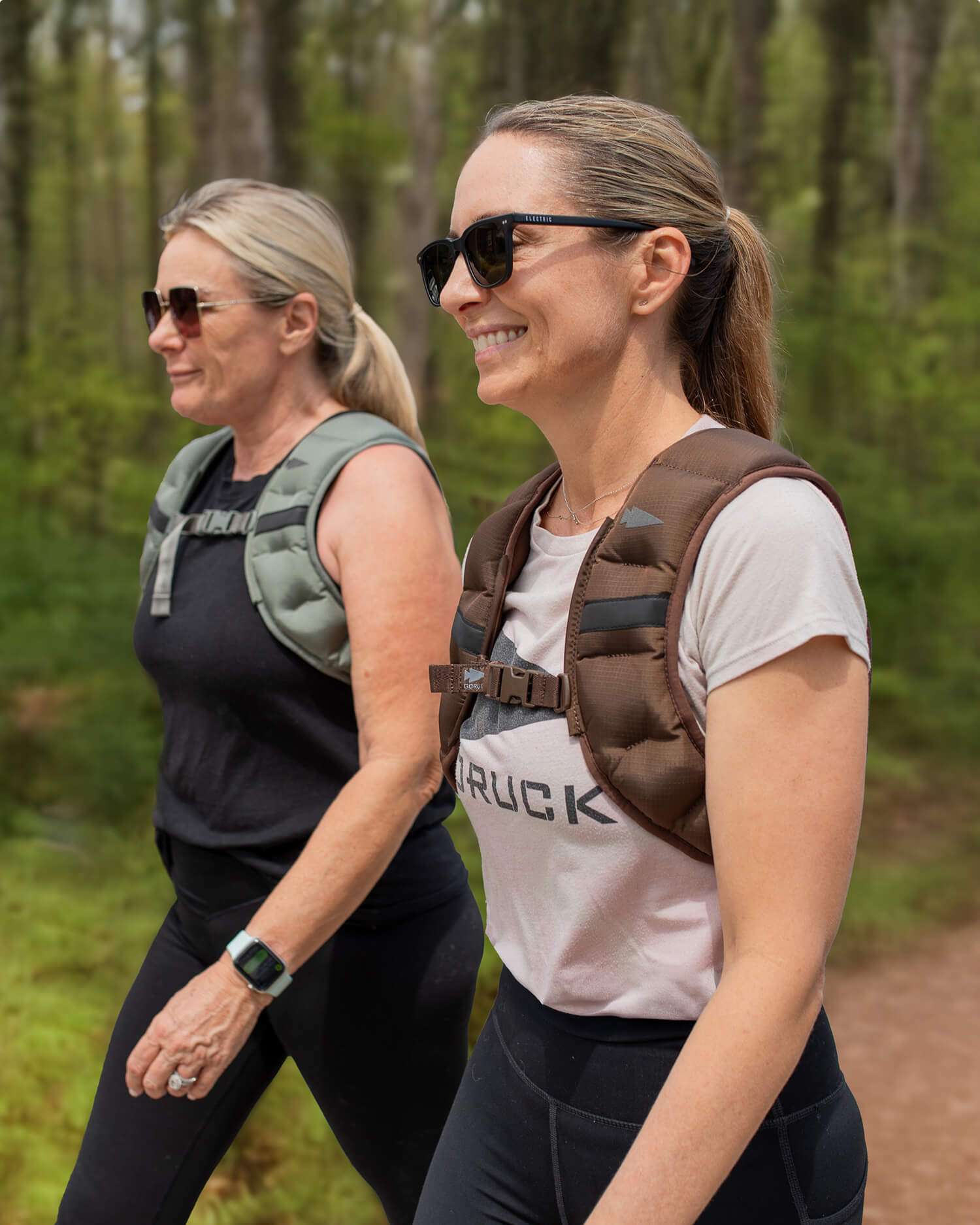 two women rucking in the woods
