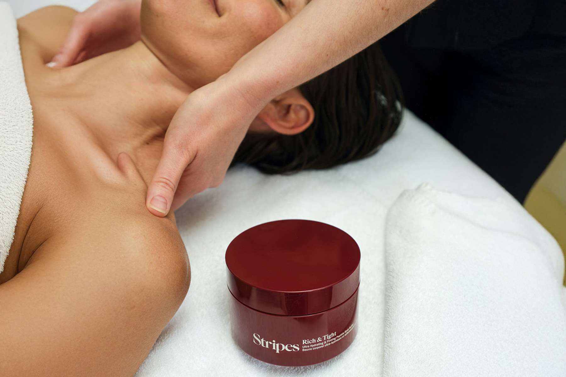 a woman getting a massage with stripes beauty products at Canyon Ranch
