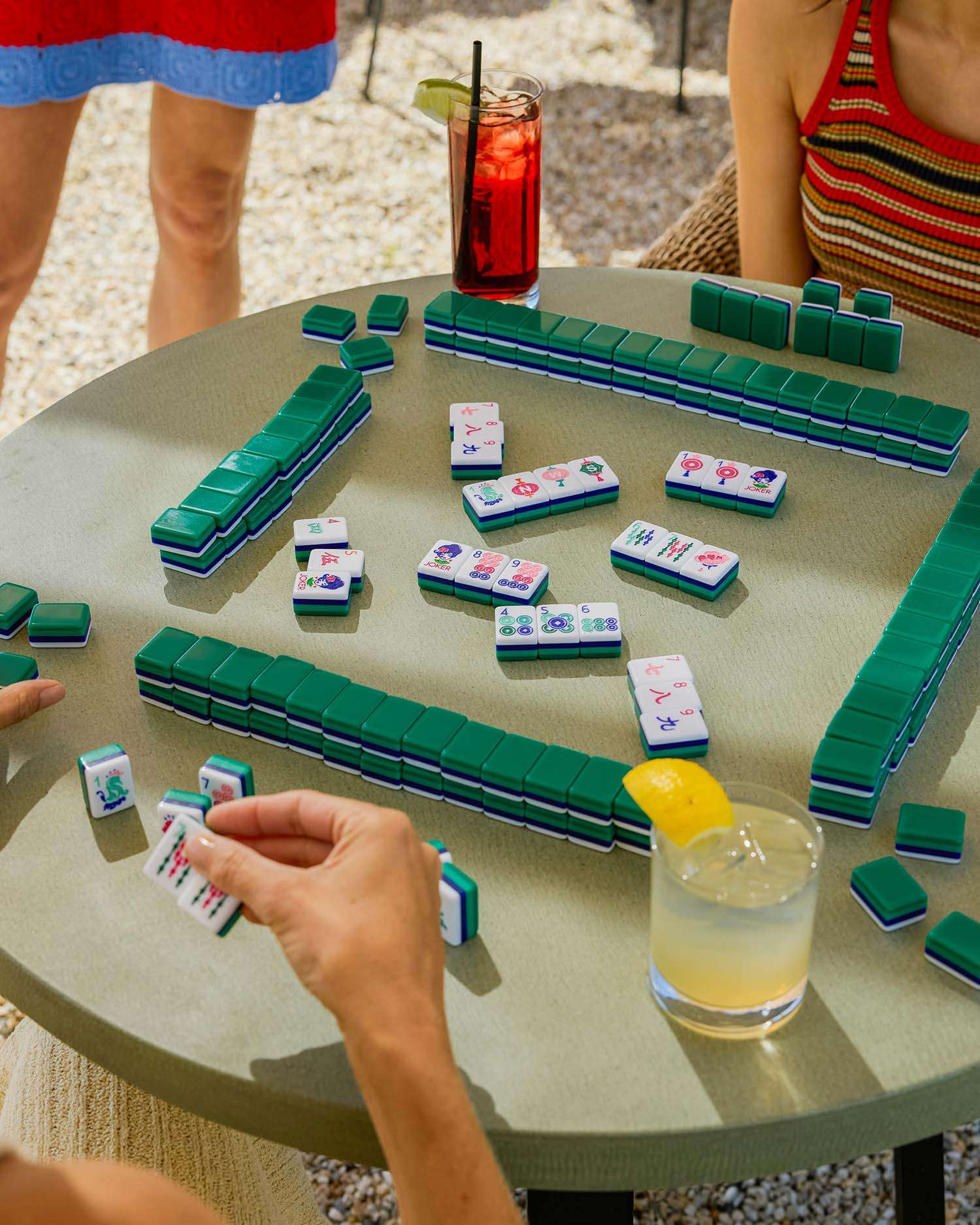 a table of people playing mahjong