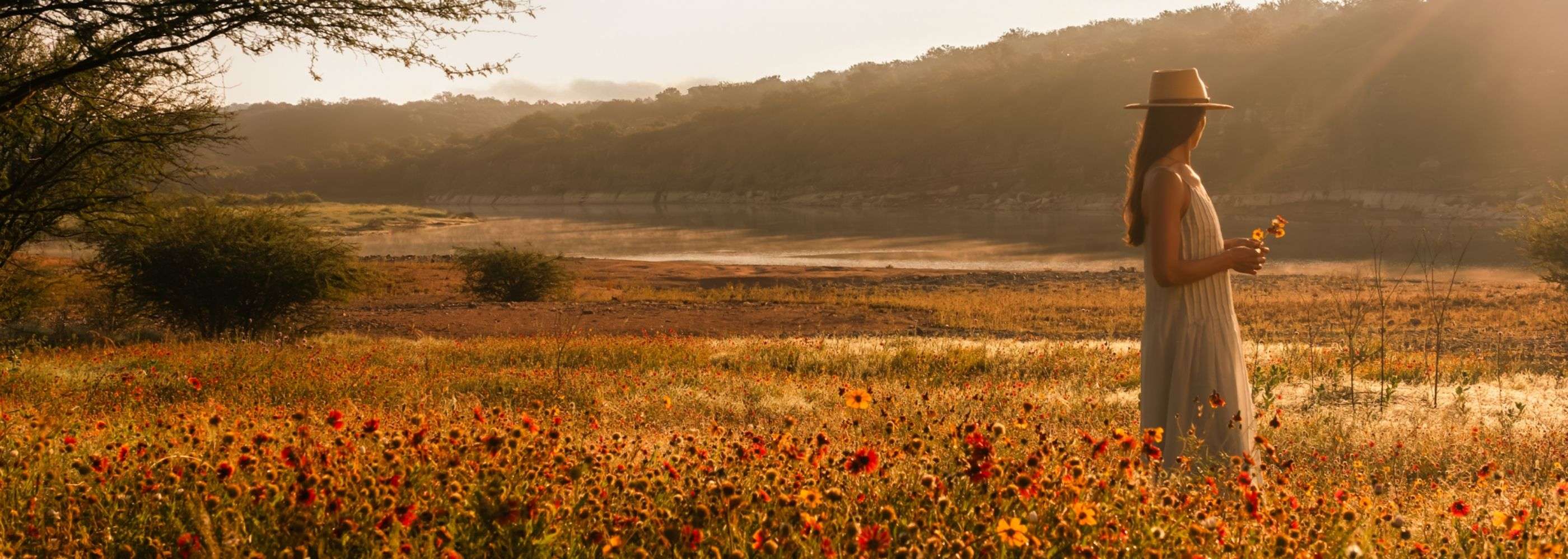 a woman in a wildflower field