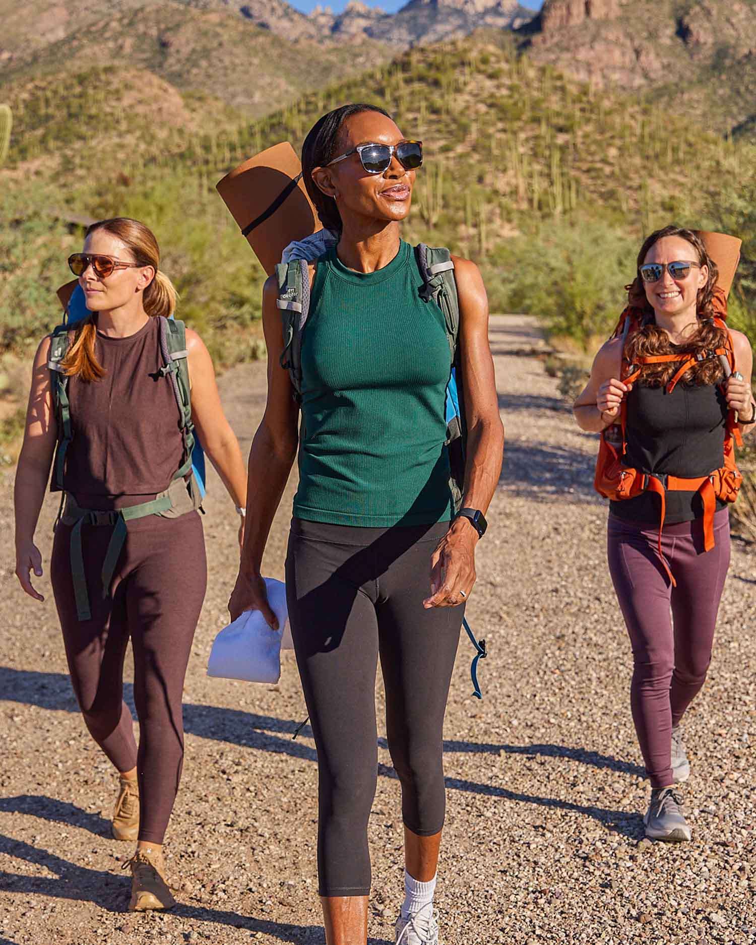 Three women hiking in the desert