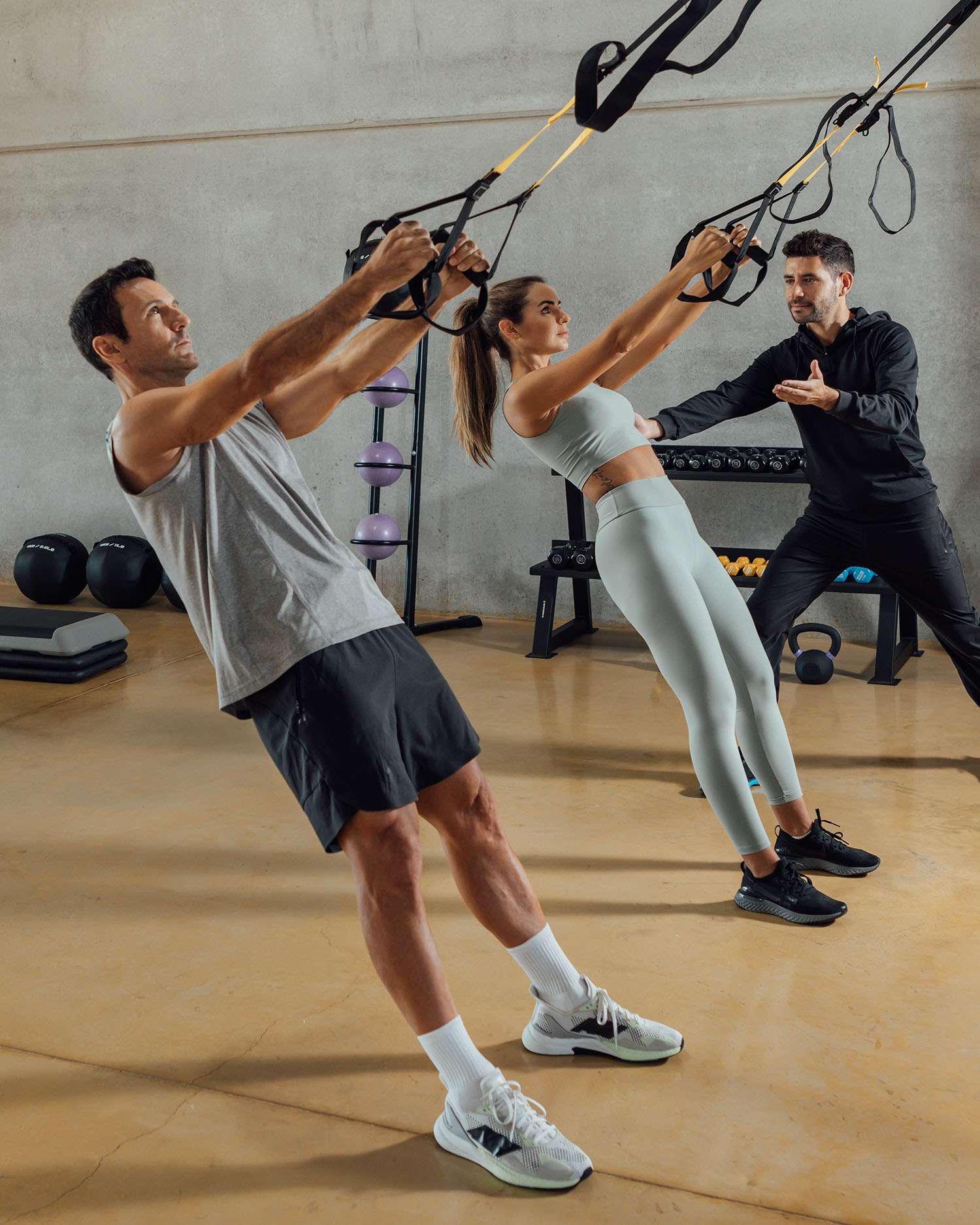 Man and Woman During a Strength Training Session with a Personal Trainer