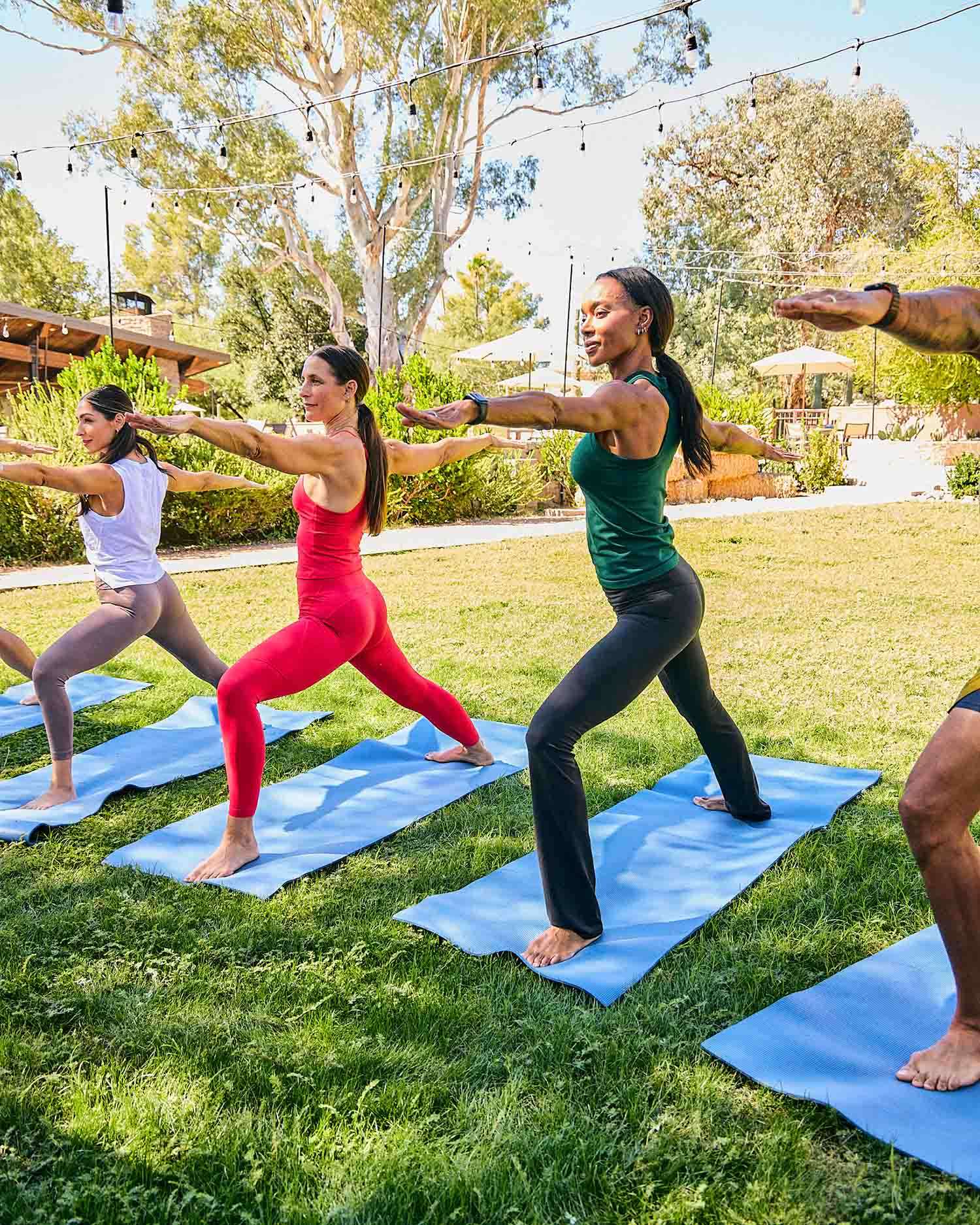 A Group Practicing Yoga Together Outdoors 