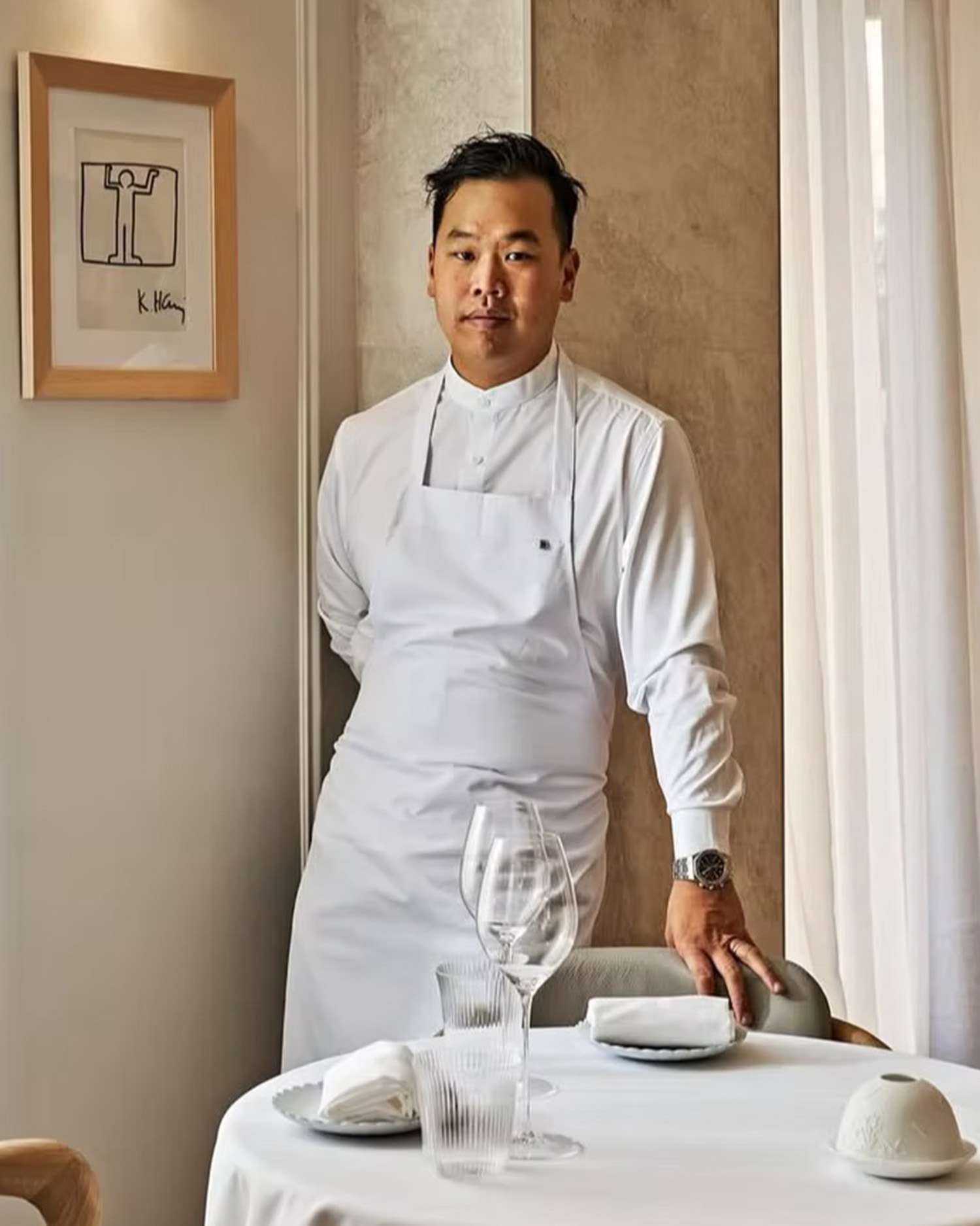 Photo of Chef Buddha Lo Standing in a Restaurant With His Uniform 