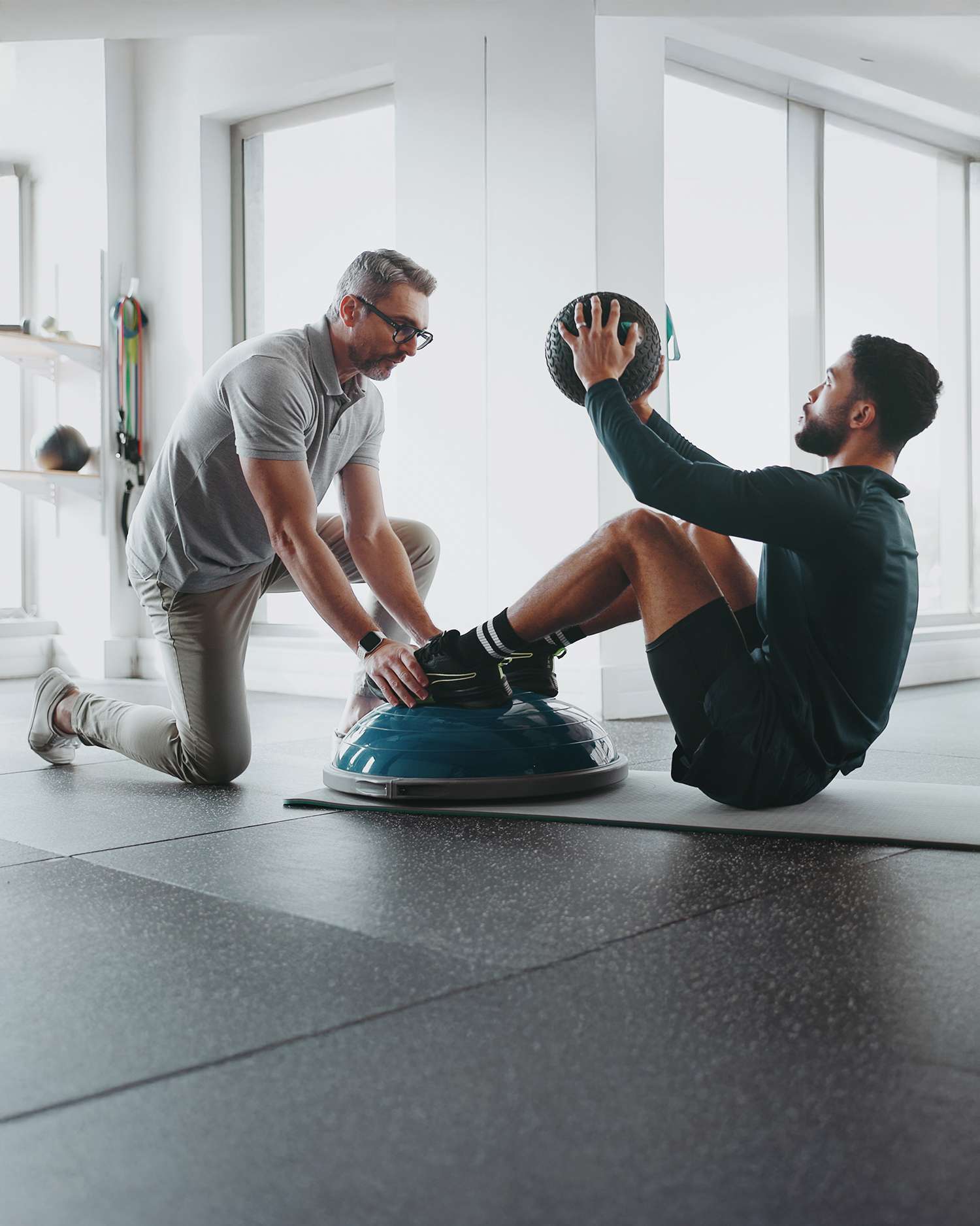 Man Training With Personal Trainer