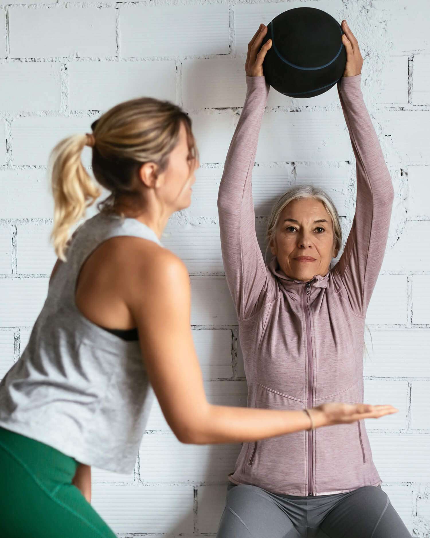 Woman Holding a Medicine Ball During Personal Training