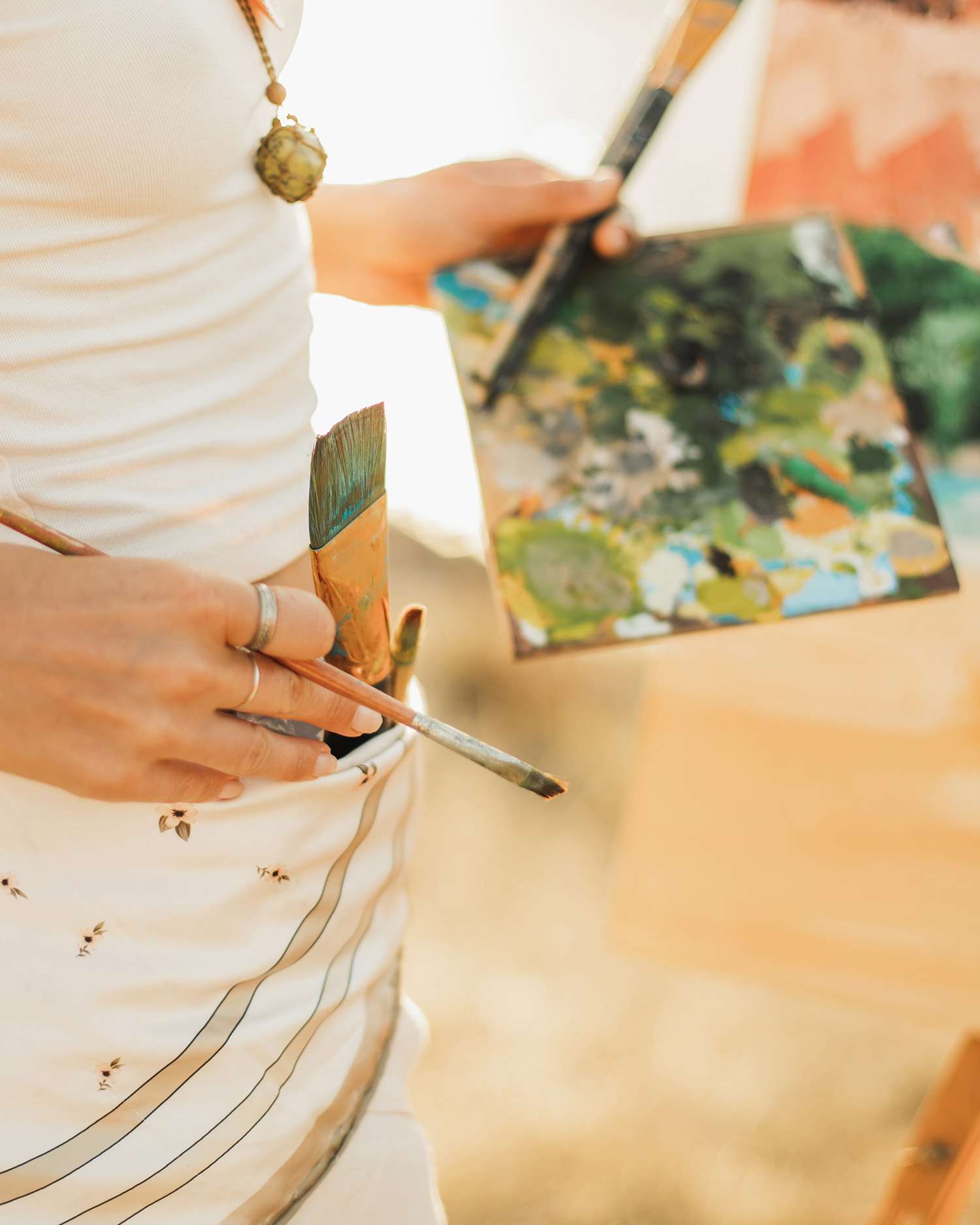 Woman Painting a Desert Landscape