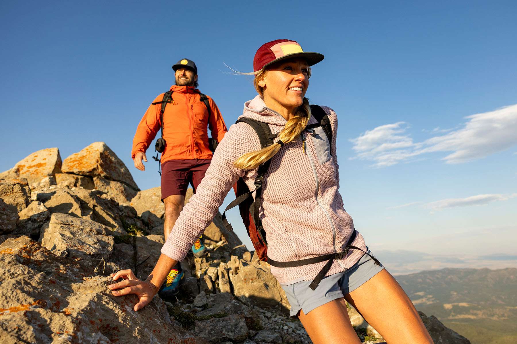 Man and Woman Hiking on Top of a Mountain 