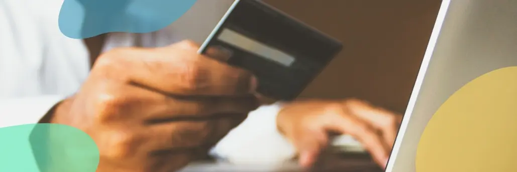 A man holding a credit card